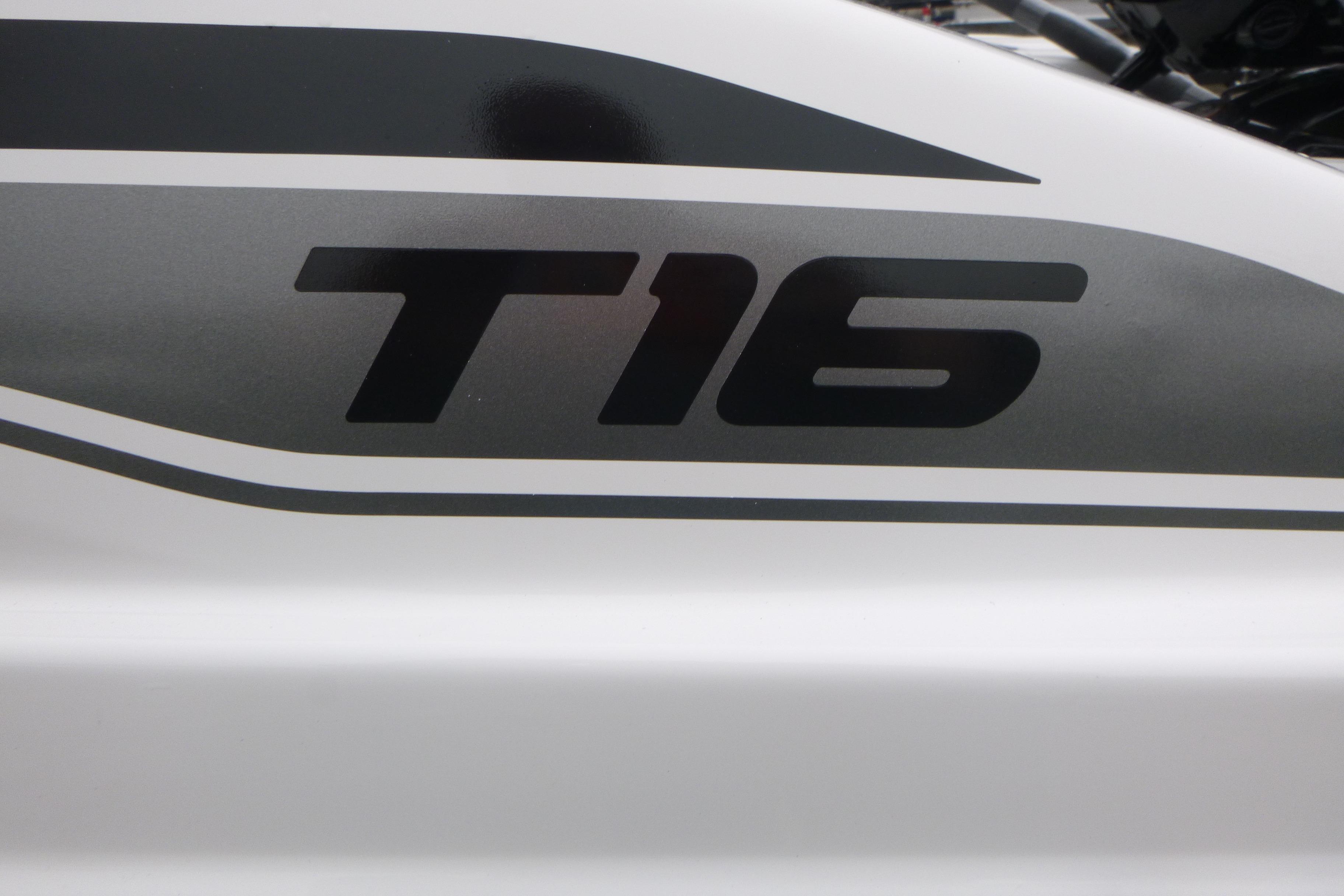 Close-up of 2026 Tahoe T16 model logo on vehicle exterior.