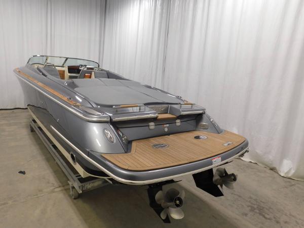 2021 Chris-Craft Corsair 34 on a trailer in a warehouse.