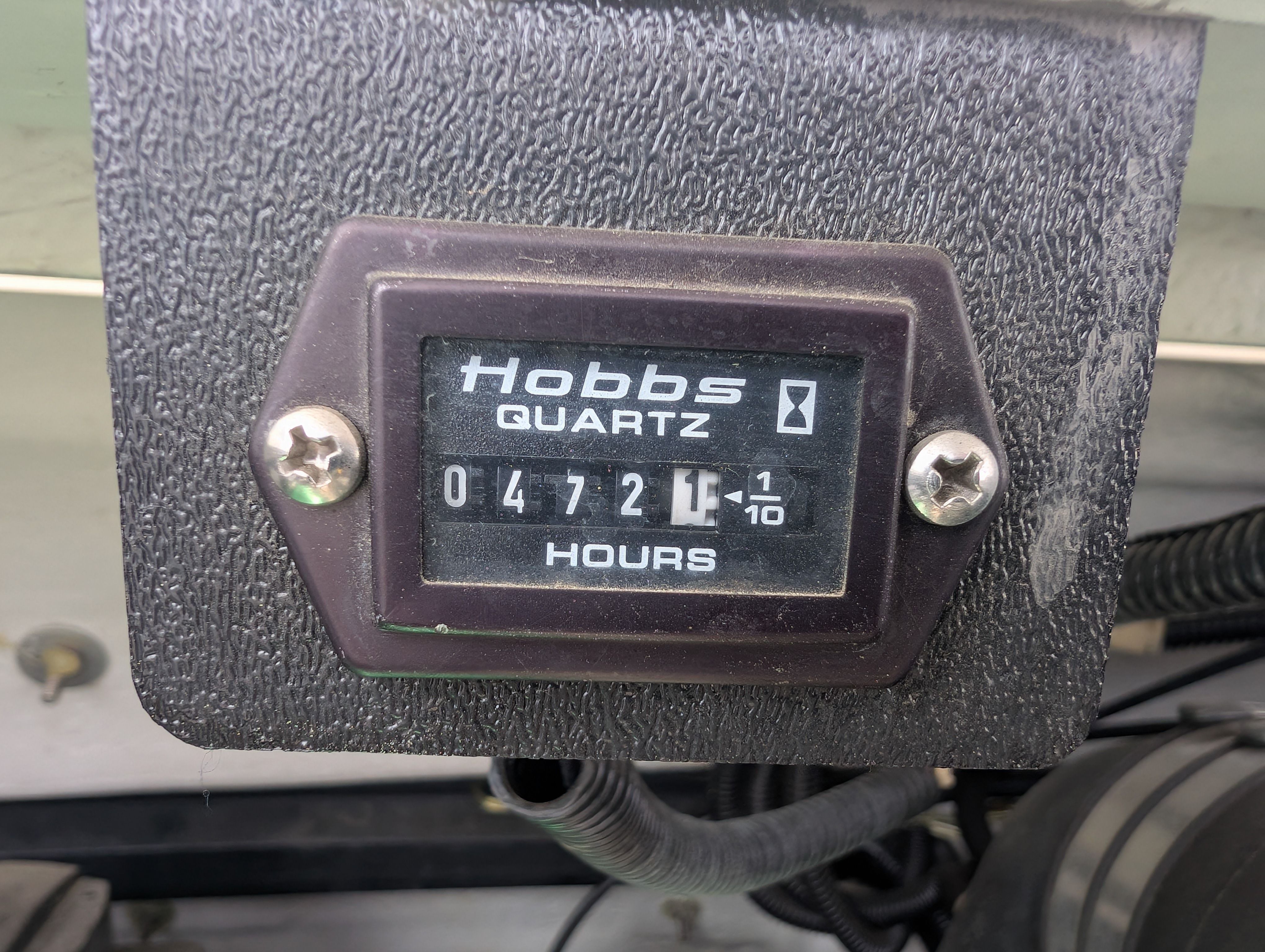 Close-up of an hour meter showing 472.6 hours on a Cobalt 190 boat.