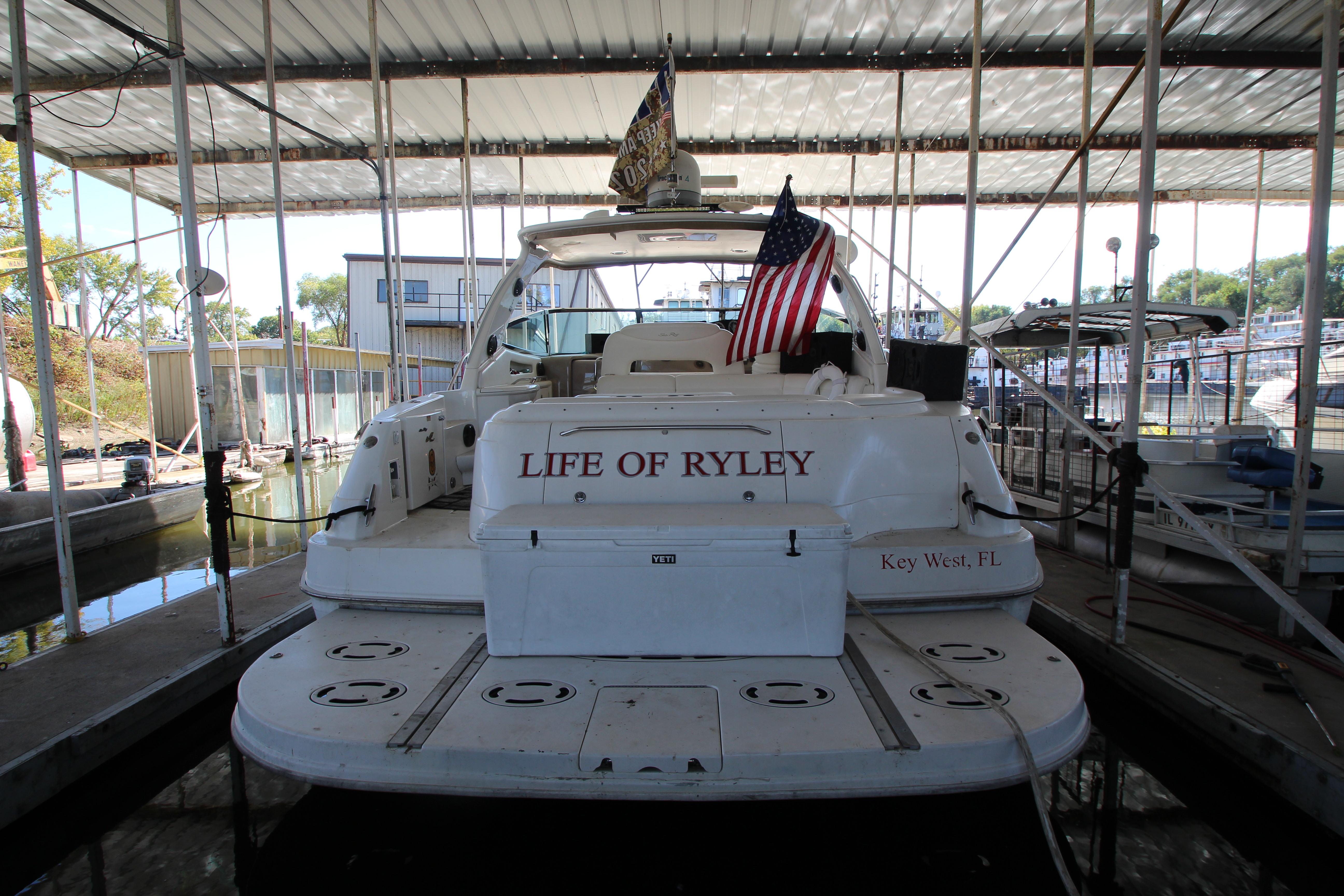 2001 Sea Ray 460 Sundancer docked, named "Life of Ryley," with American flag.