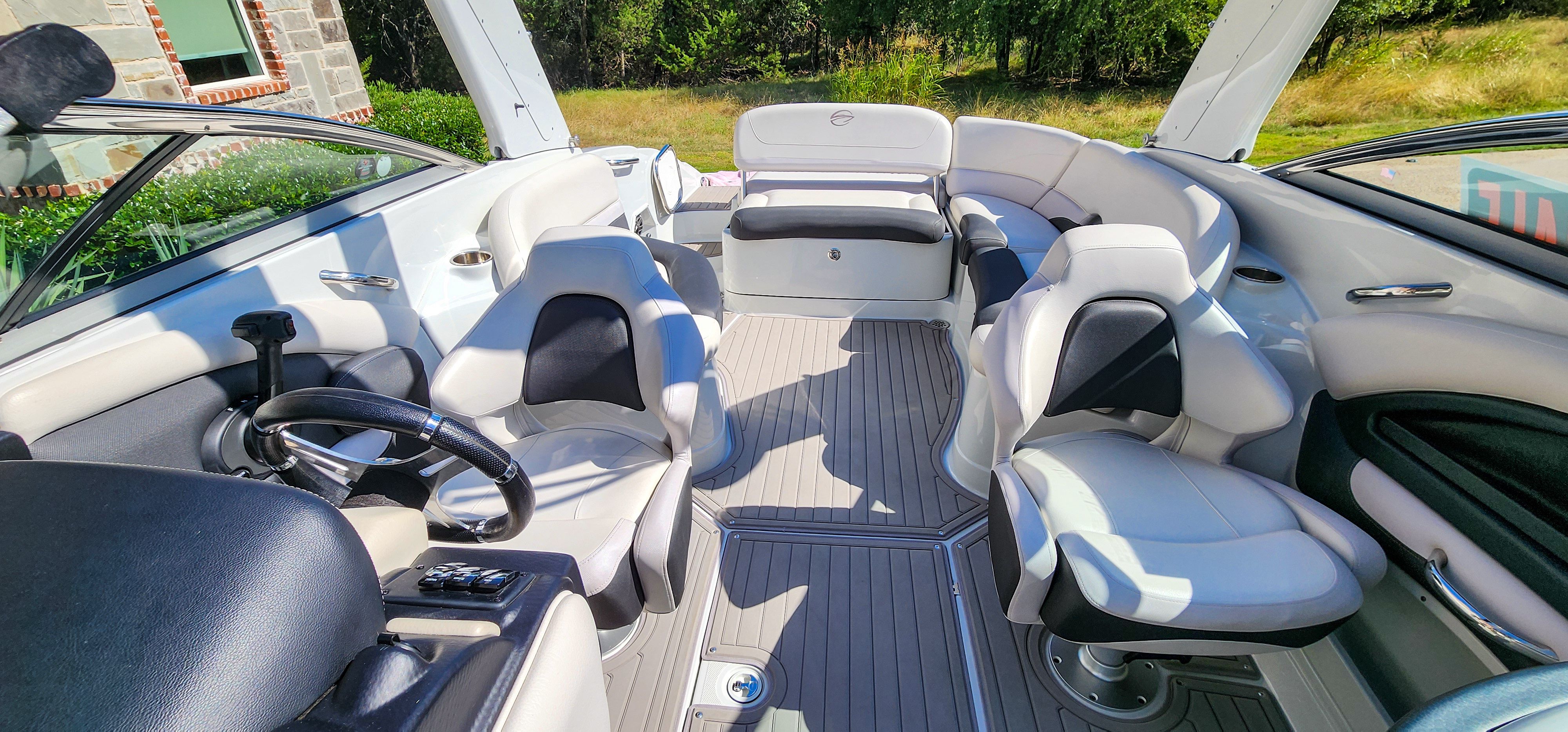 Interior of a 2017 Crownline 285SS boat with white and black seating.