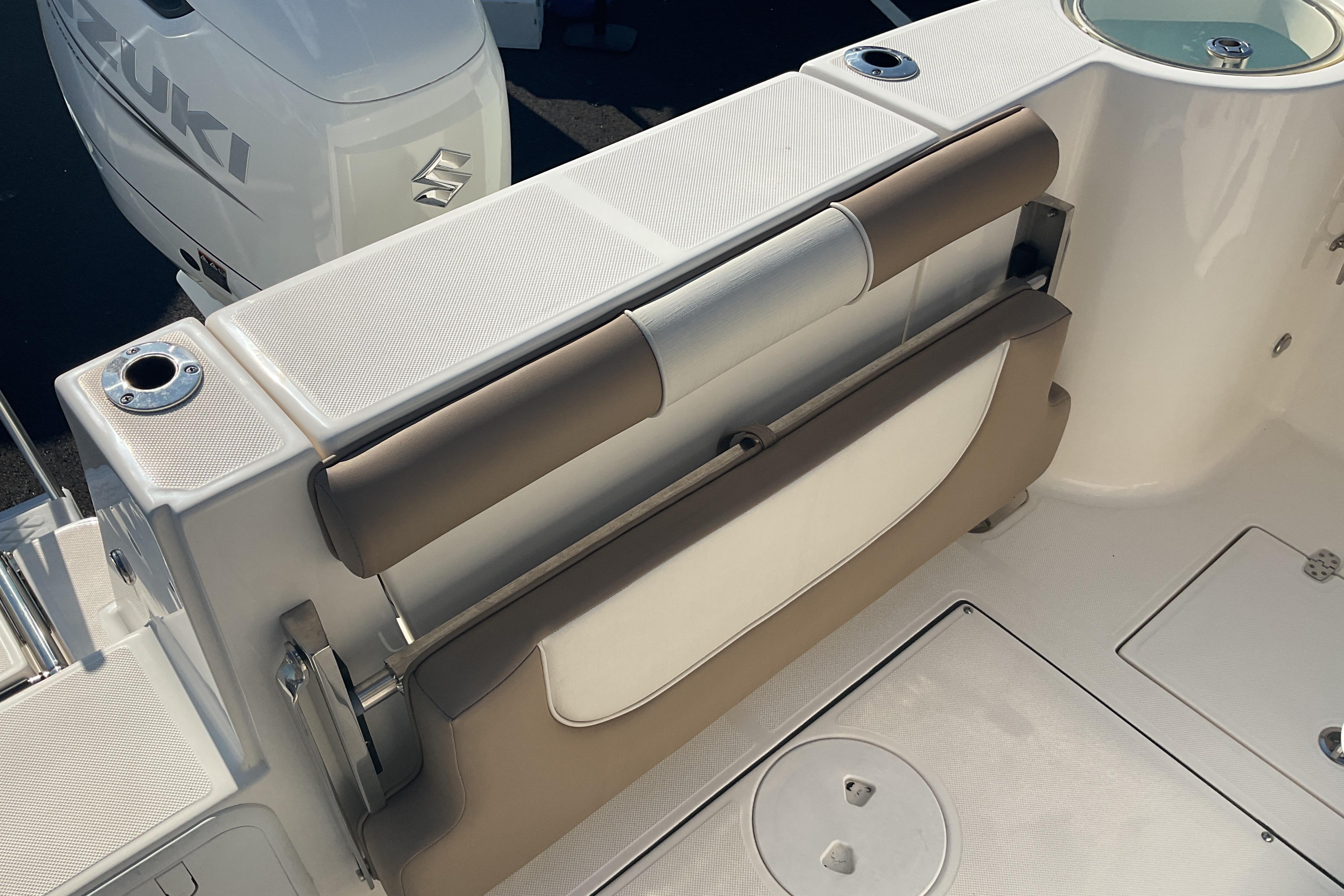2023 Sea Born SX239 Offshore boat interior with Suzuki engine, featuring seating and storage.