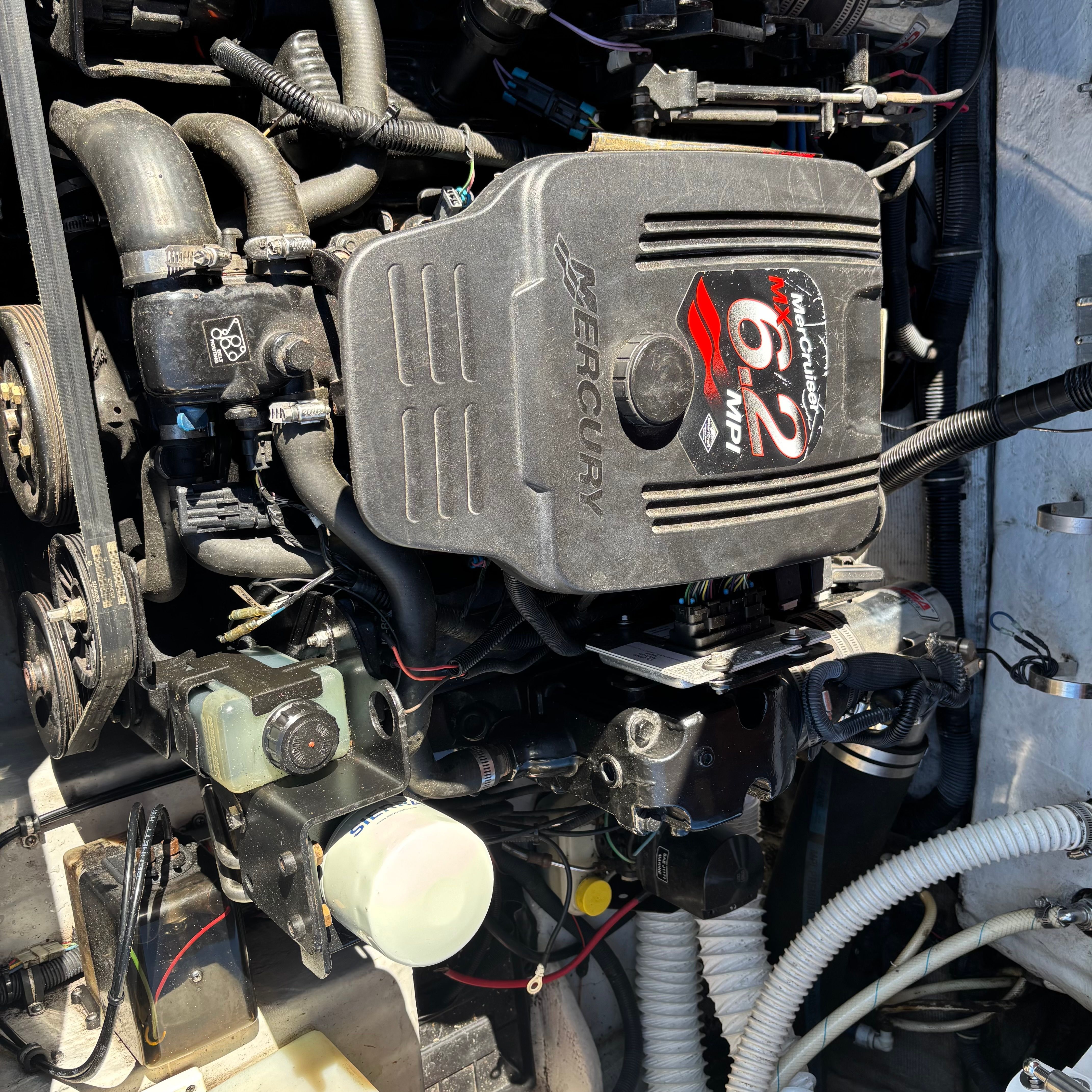 Engine compartment of a Chris-Craft Launch 22 boat with a Mercury 6.2L engine.