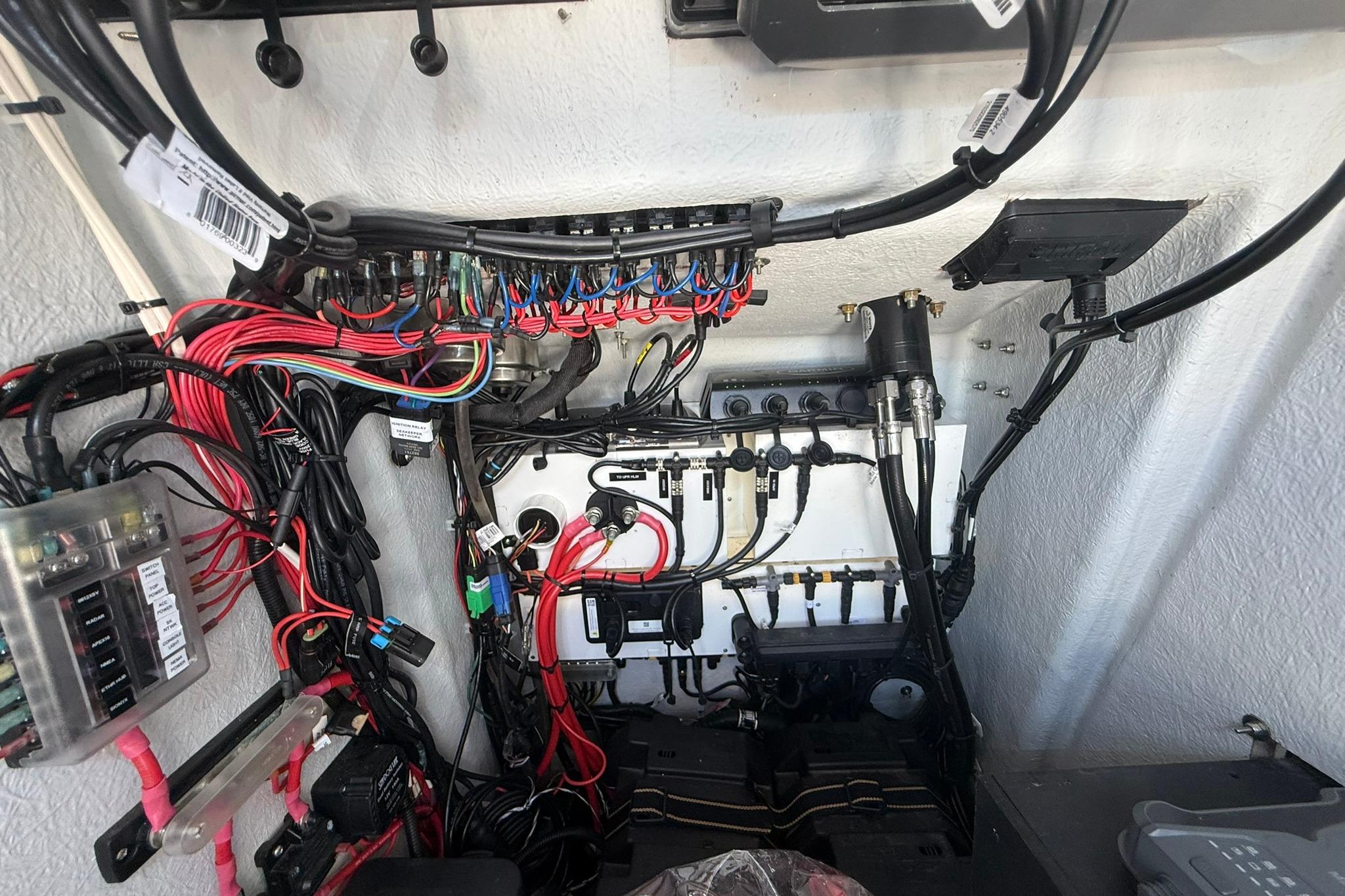 Electrical wiring and components inside a 2024 Pair Customs 24 Center Console MV boat.
