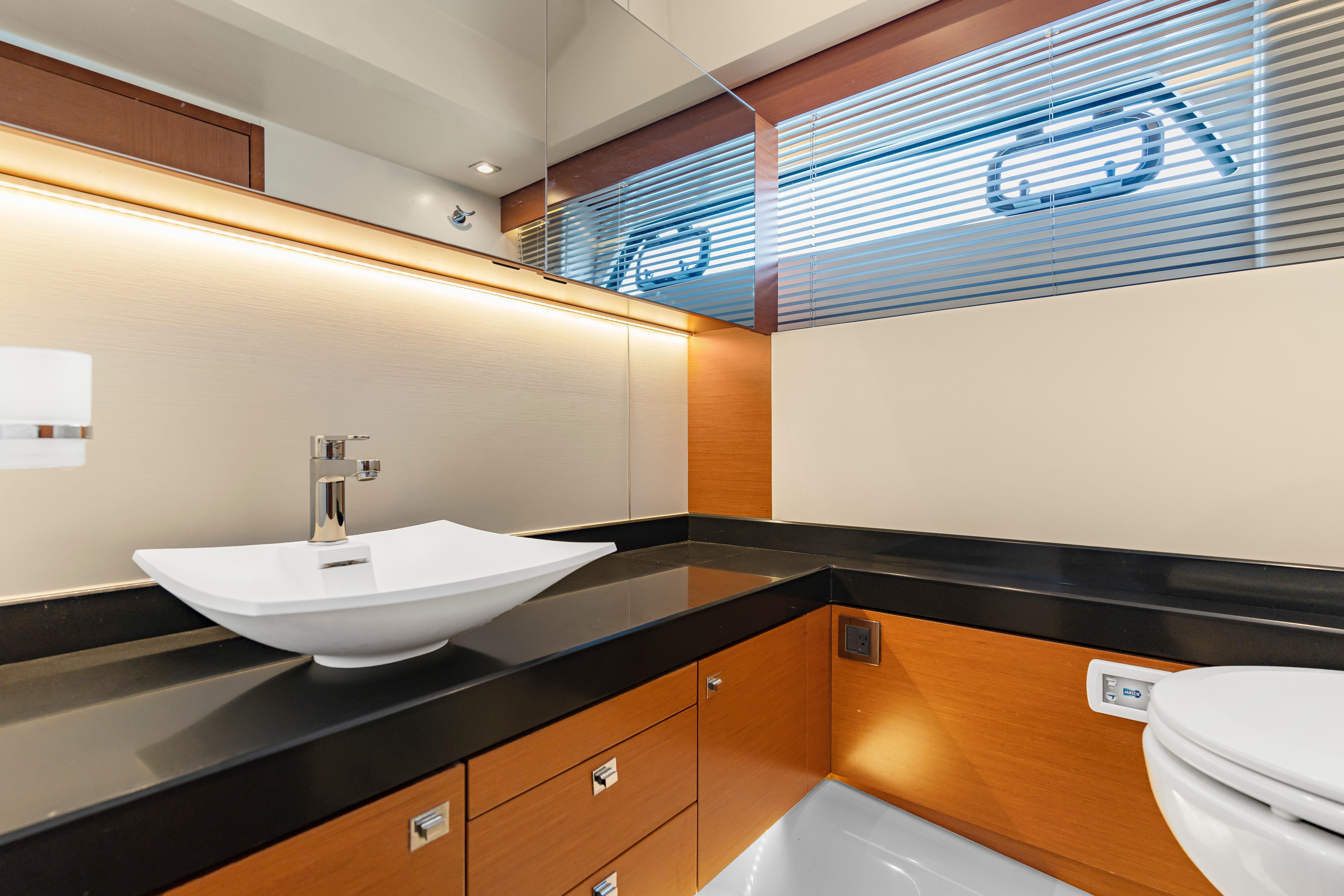 Luxurious bathroom interior on a 2017 Prestige 500 yacht, featuring modern sink and sleek design.