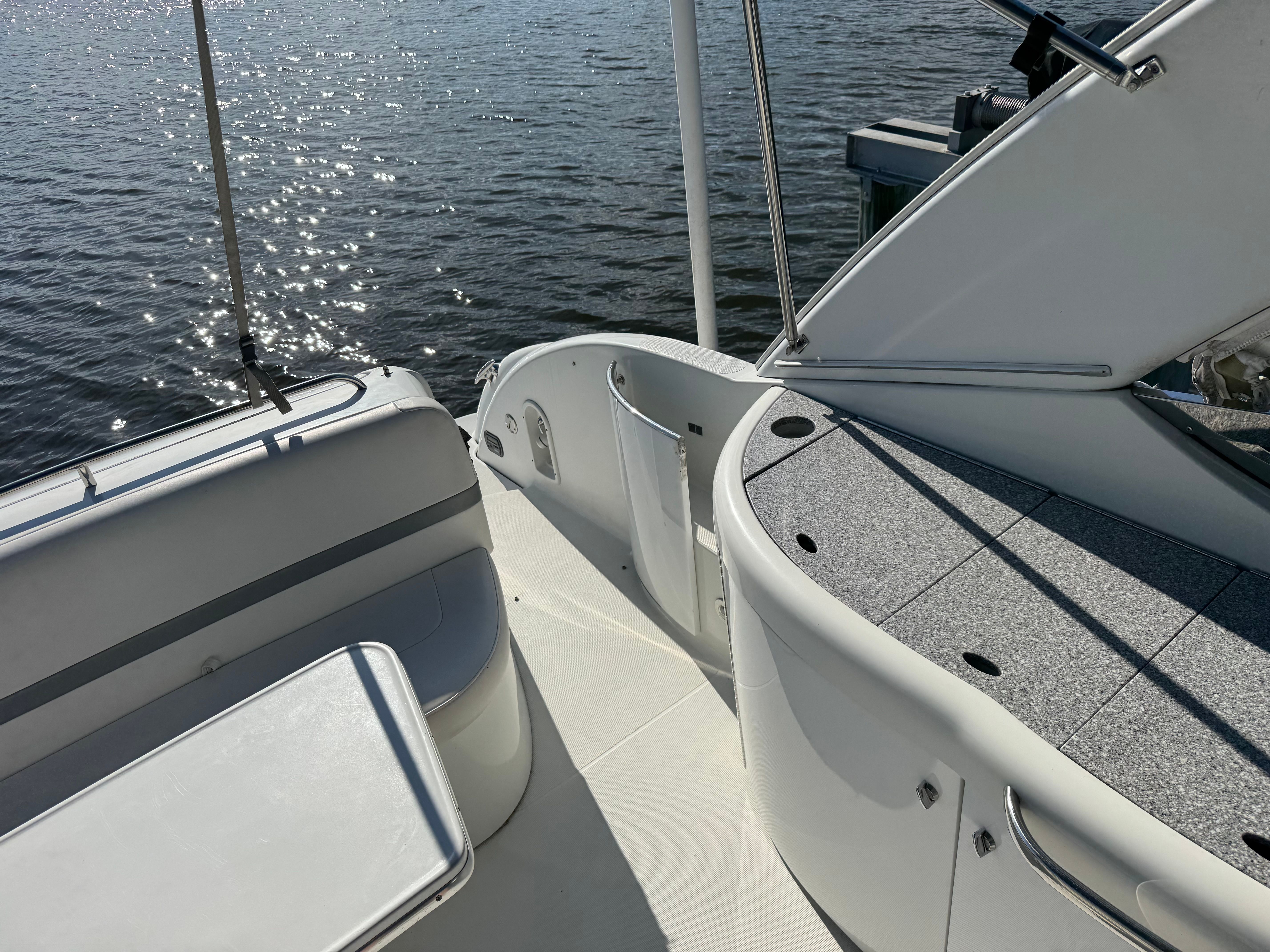 The boat features a modern deck design with gray and white surfaces.
