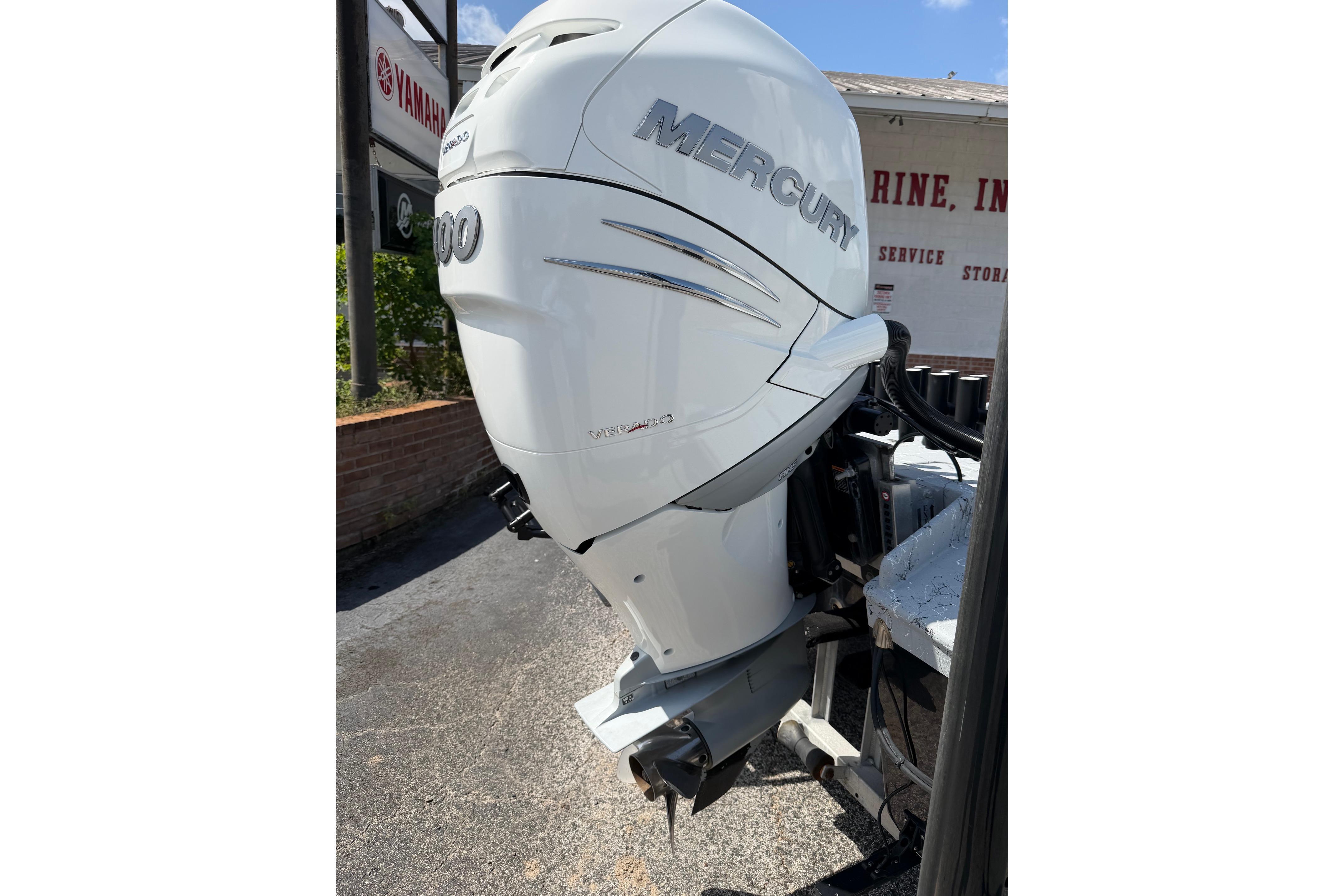 2023 Haynie 23 Super Cat with Mercury outboard motor, parked outdoors.