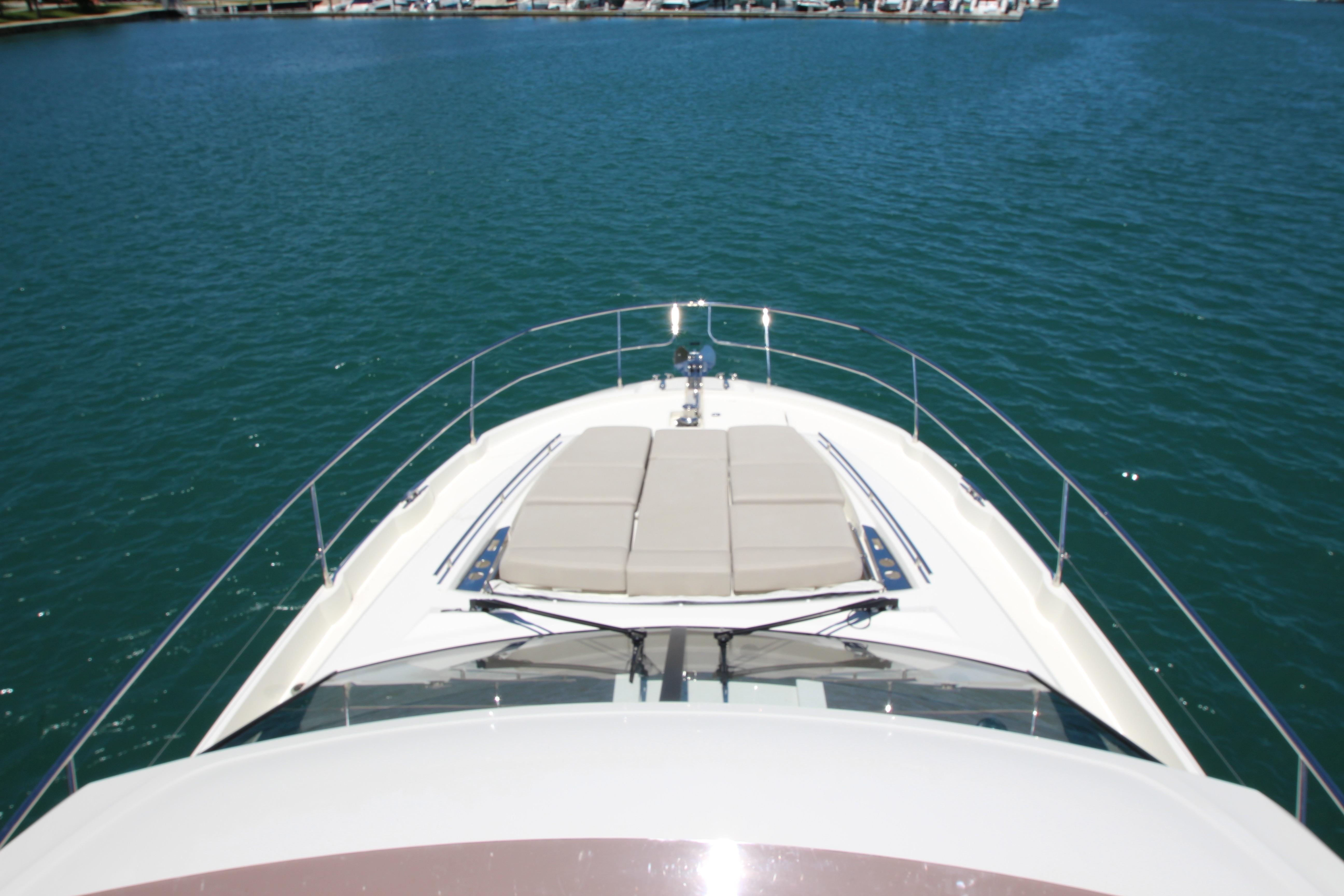 Prestige 520 yacht, 2022 model, cruising on serene blue waters.