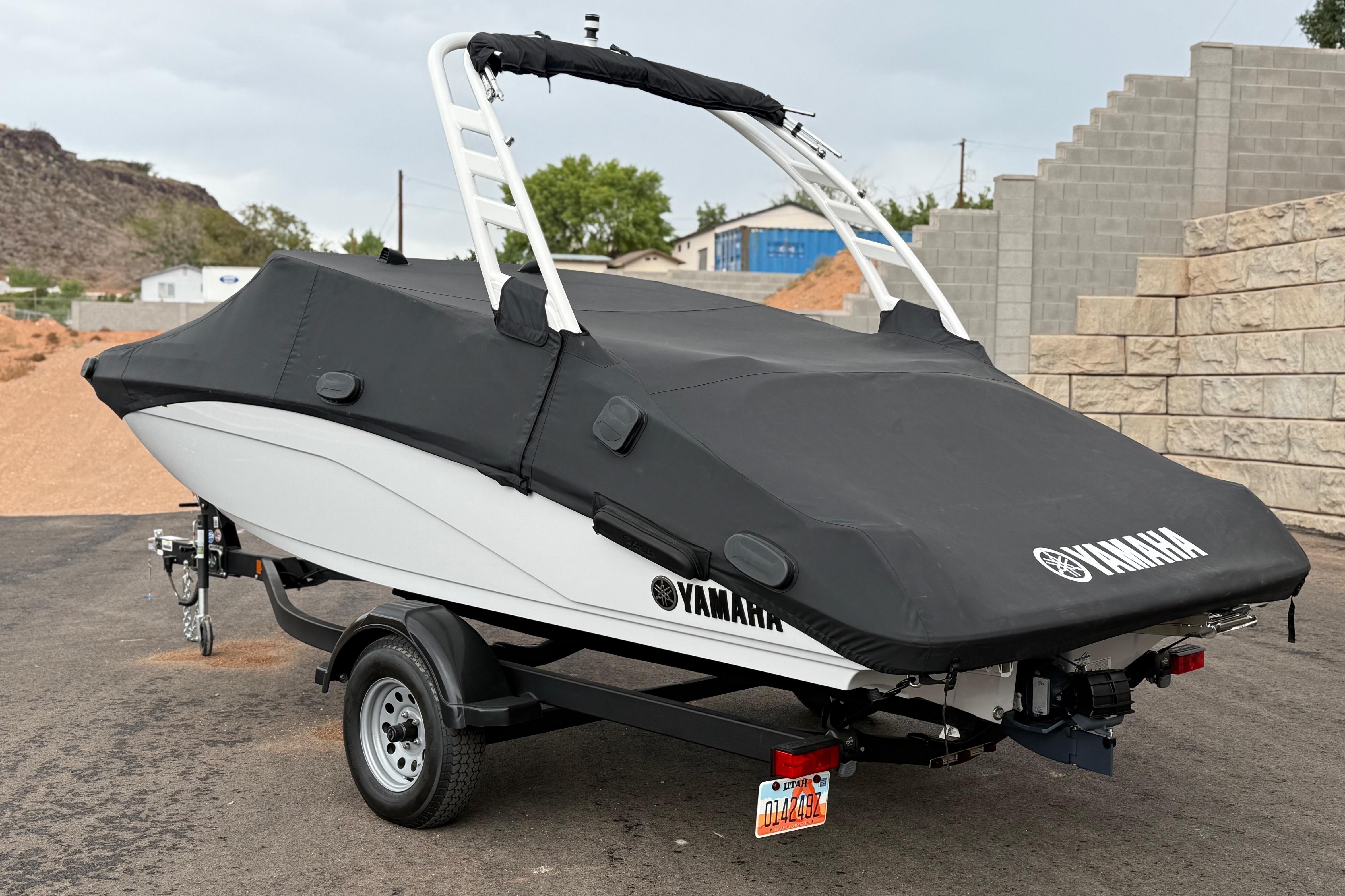 2025 Yamaha Boats 195S covered on trailer, parked outdoors.