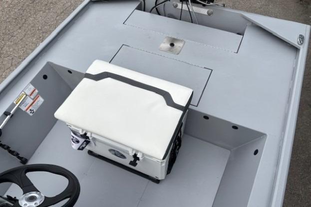 2026 Tracker Bass Tracker Classic CC boat interior with steering wheel and cushioned seat.