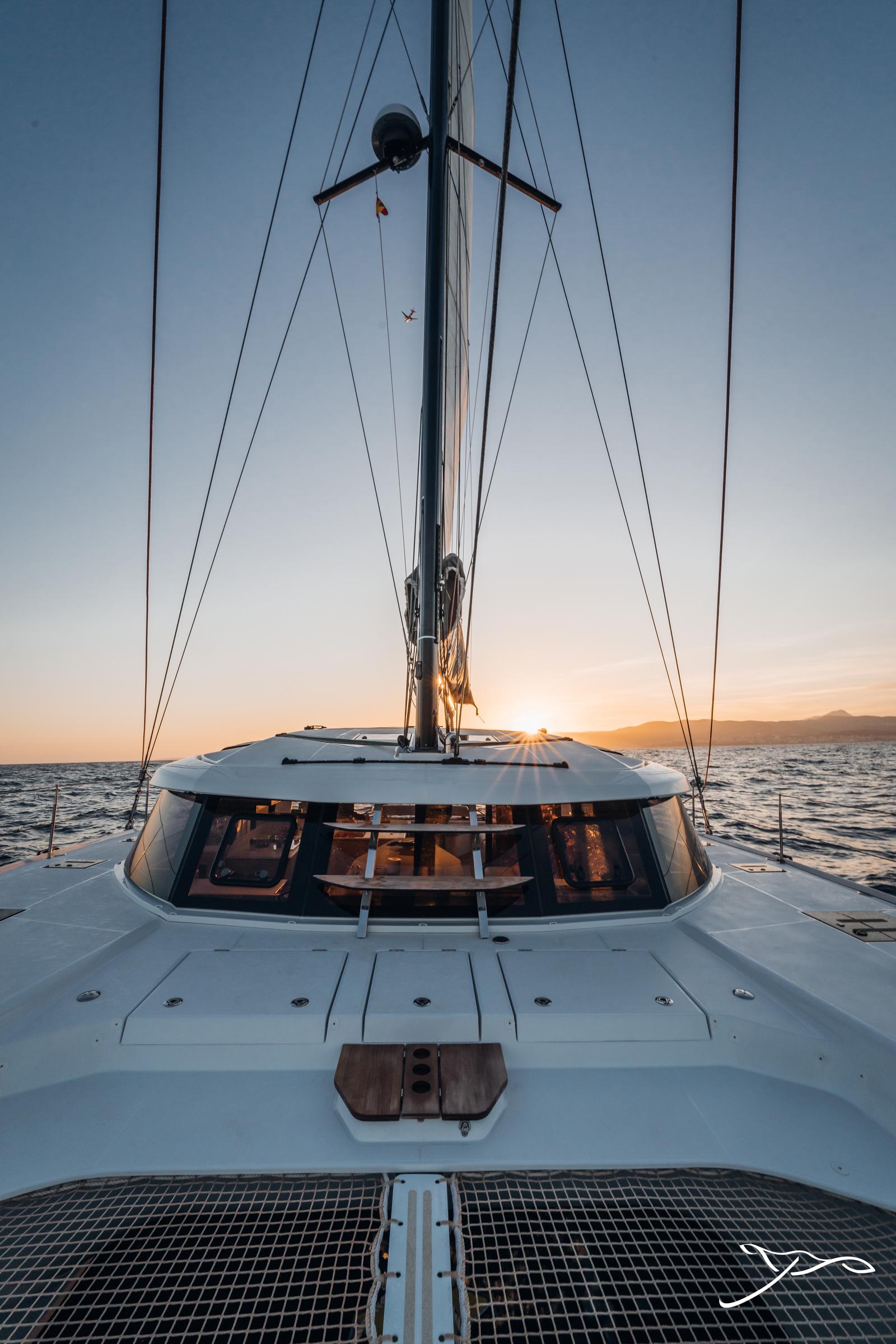 2025 Nautitech 44 Open sailing at sunset on open sea.
