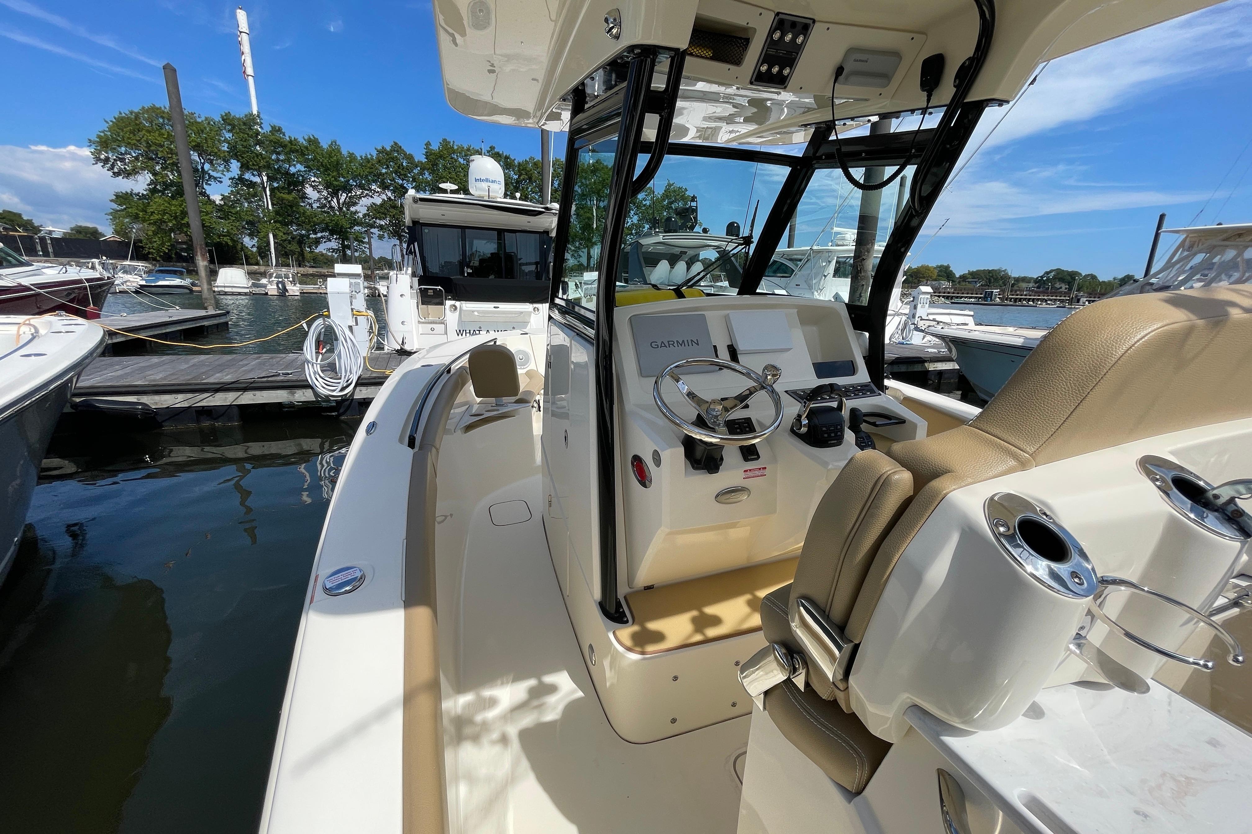 2020 Scout 255 LXF boat interior with helm, docked at marina.