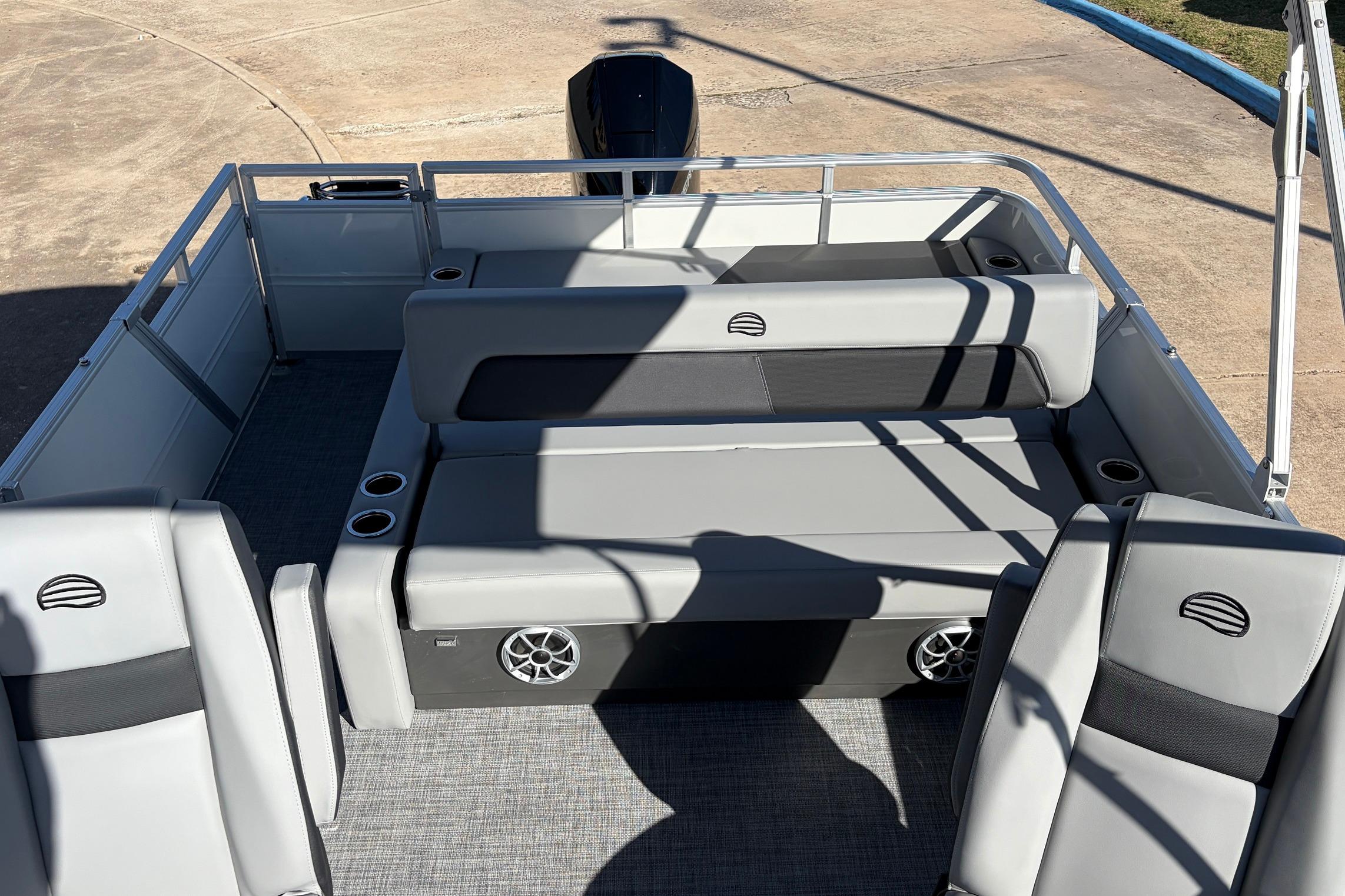 2026 Sun Tracker Party Barge 22 RF XP3 interior with gray seating and cup holders.