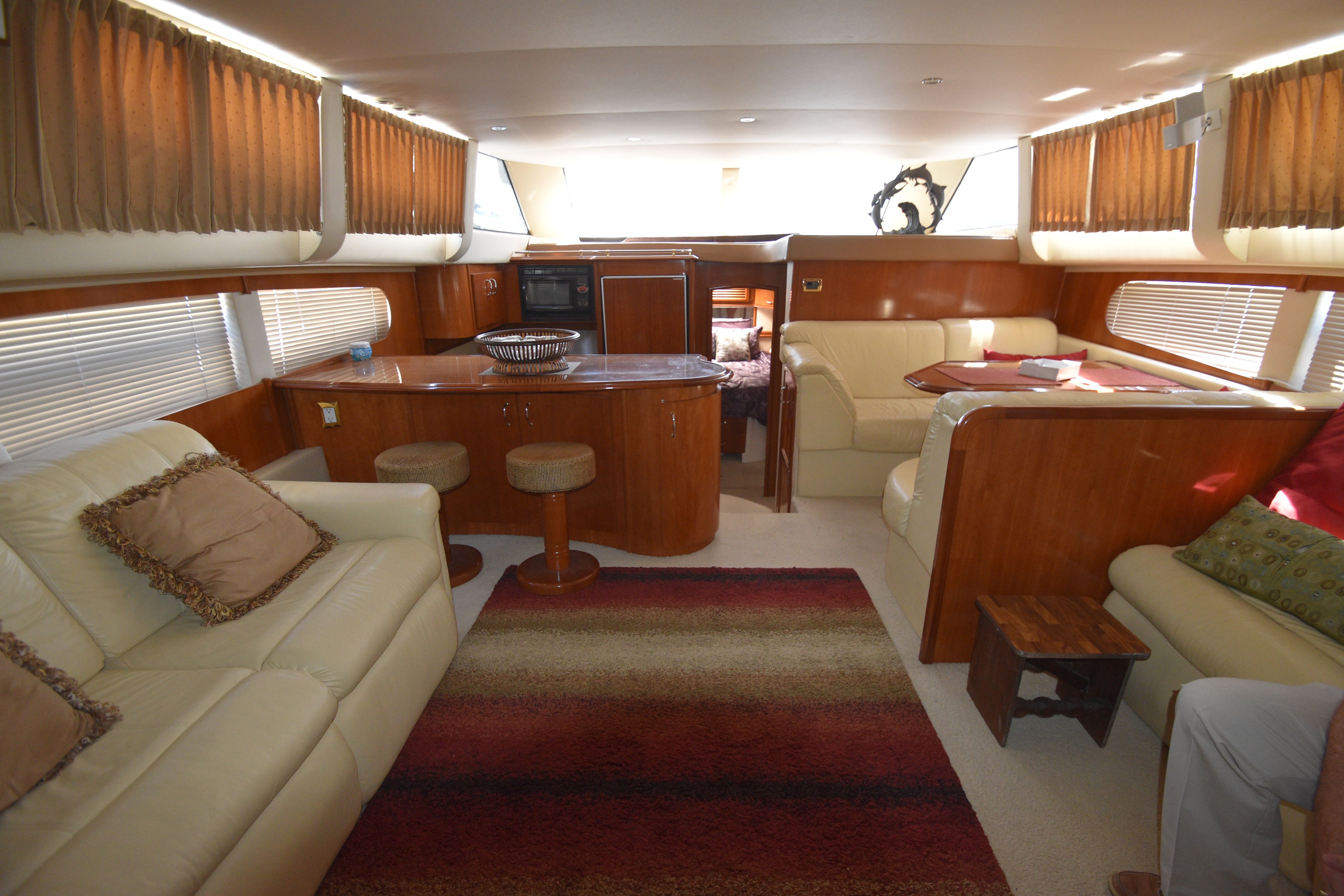 Interior of the 2004 Carver 466 Motor Yacht with elegant furnishings and a cozy atmosphere.