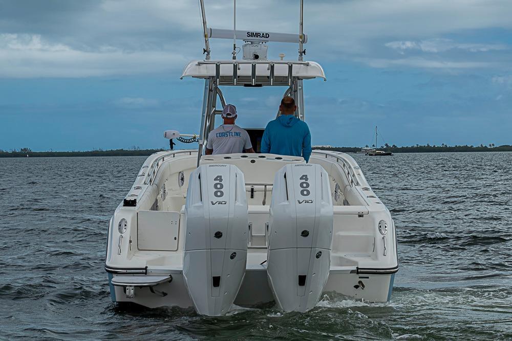 2007 Triton 351 CC boat with dual 400 V10 engines on open water.