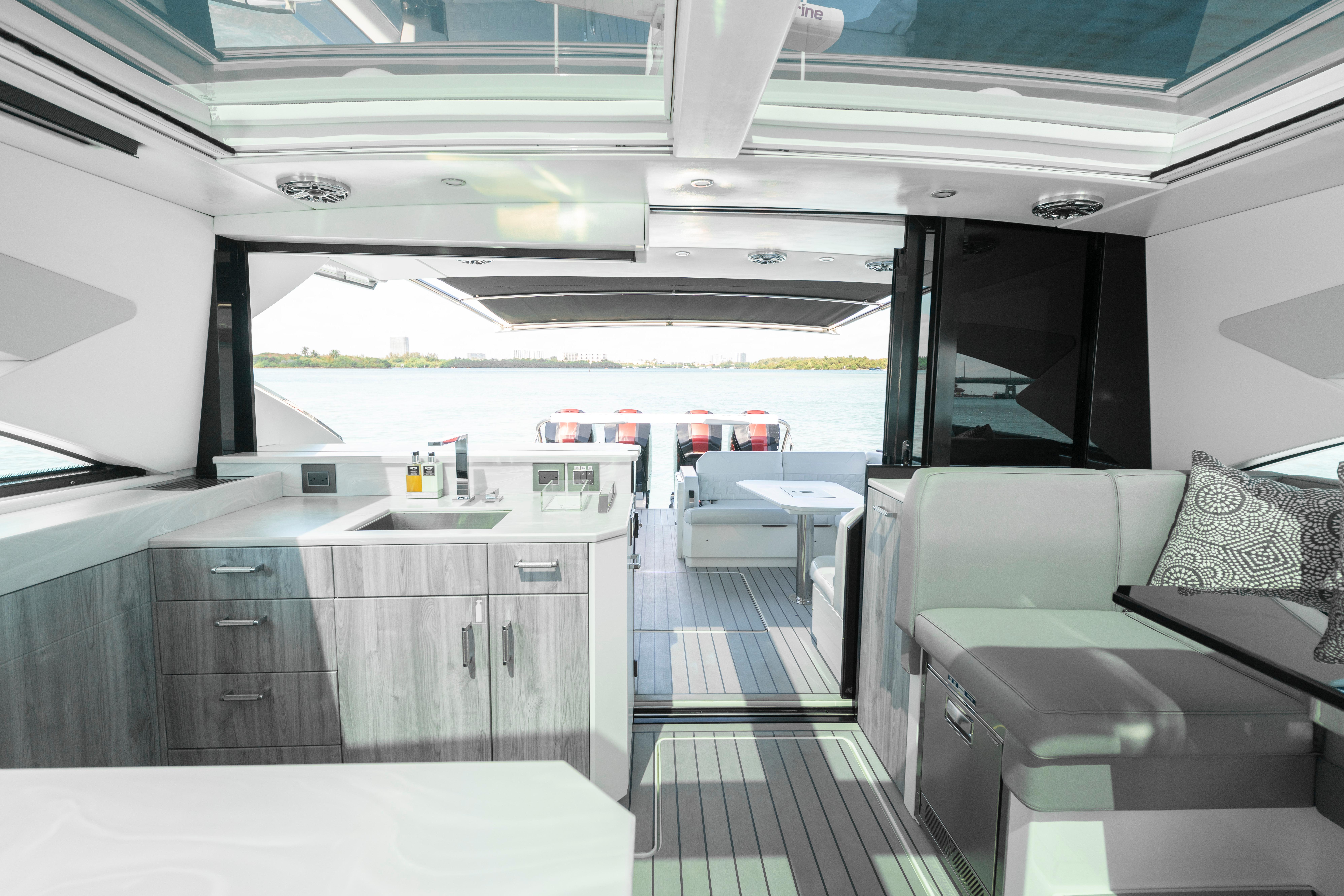 Luxurious interior of 2022 Formula 500 Super Sport Crossover yacht with modern kitchen and seating.