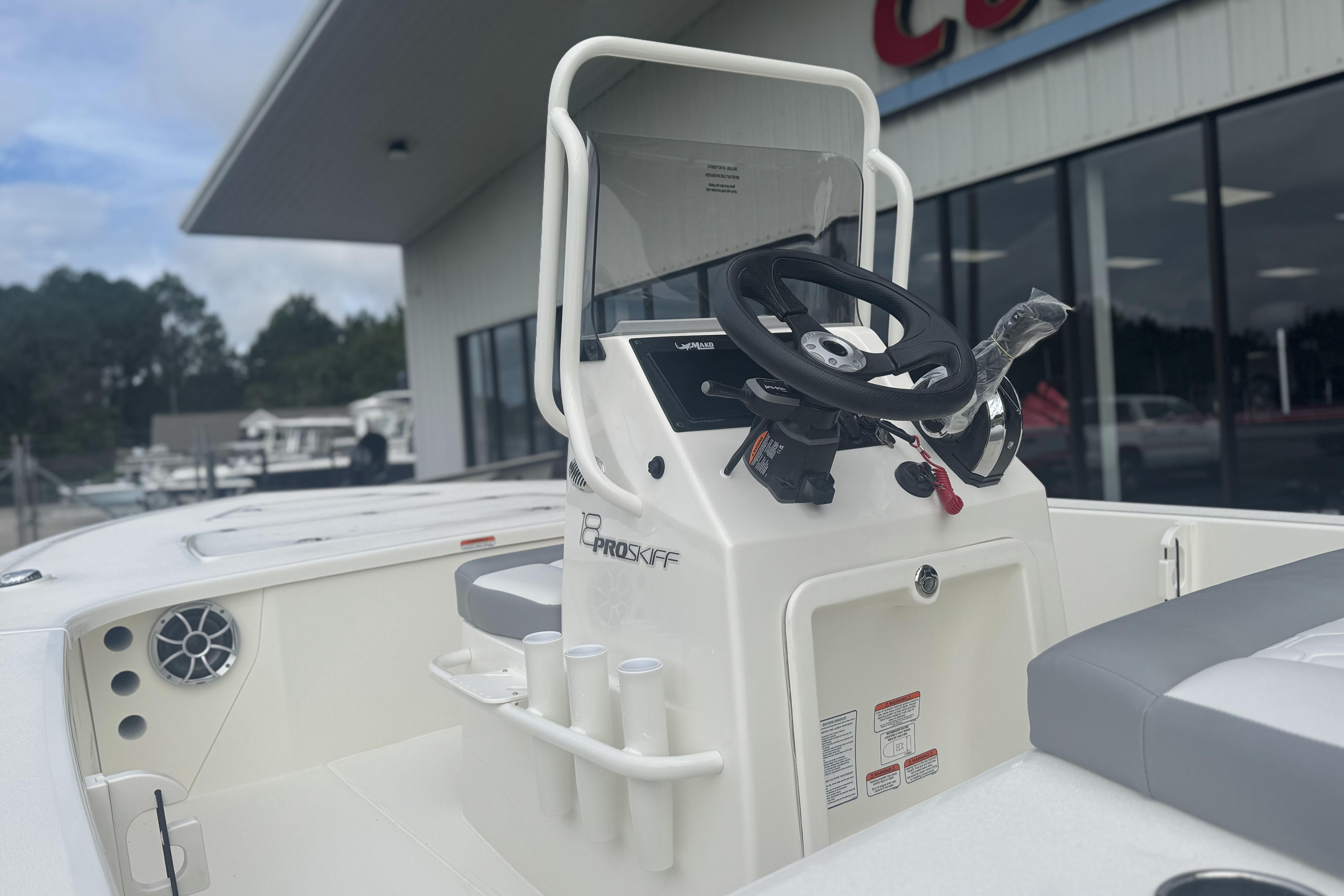2026 Mako 18 Pro Skiff boat interior with steering console and seating.