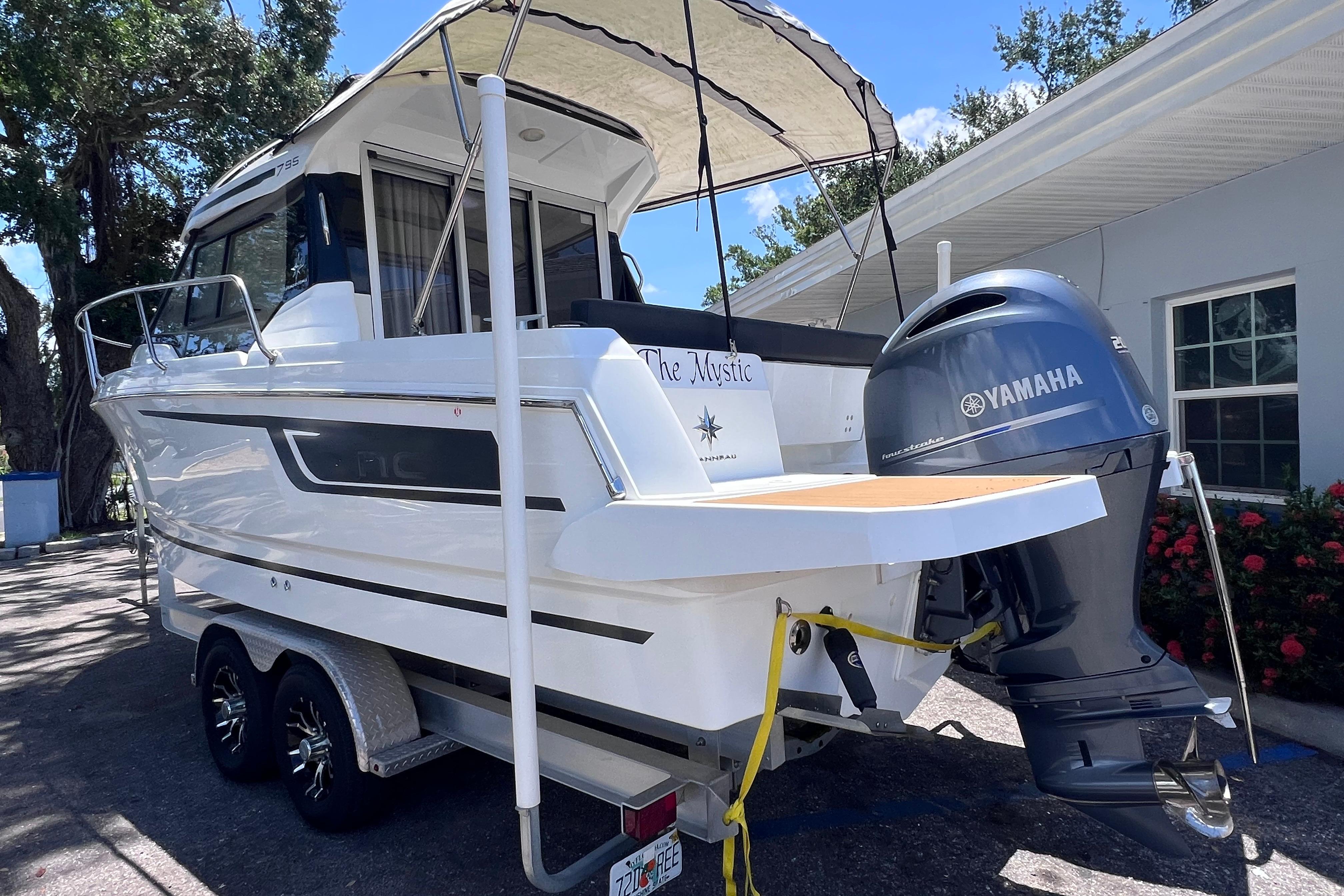 2021 Jeanneau NC Weekender 795 Series 2 boat with Yamaha outboard motor on trailer.