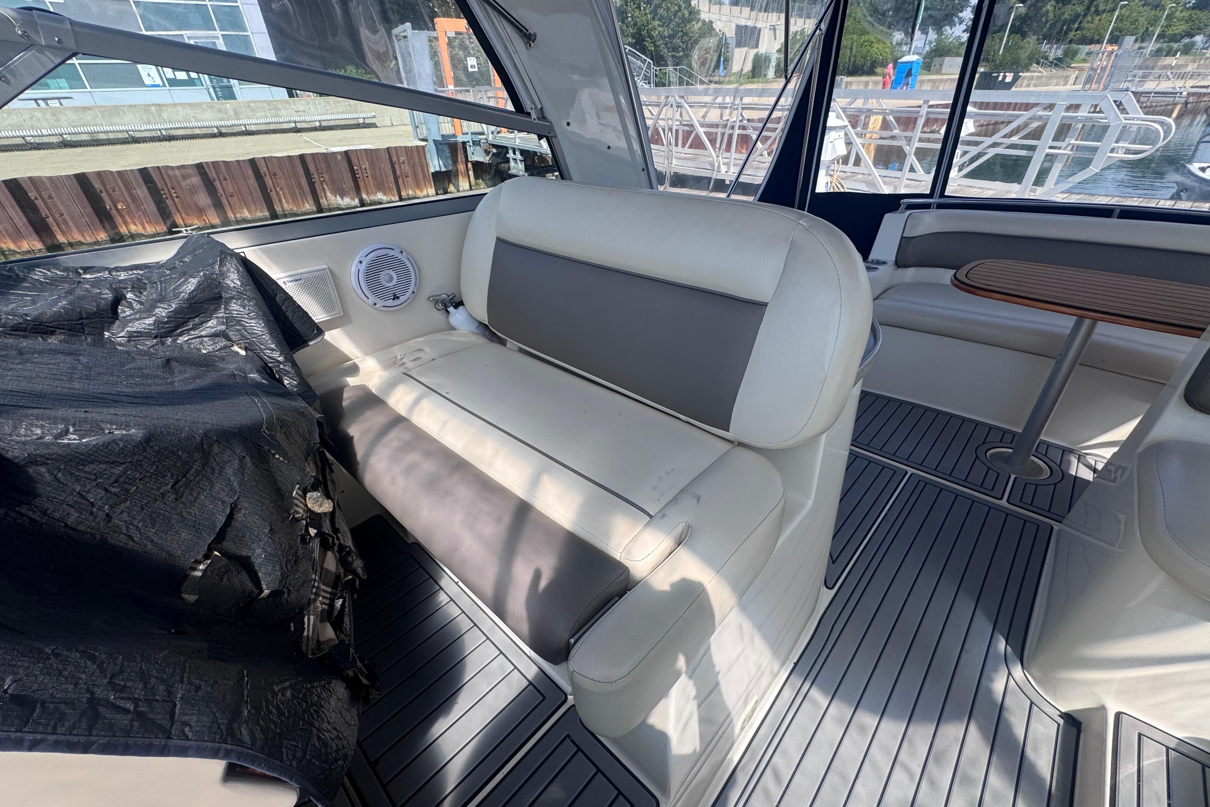 Interior of 2003 Rinker Fiesta Vee 312 boat with seating and table.