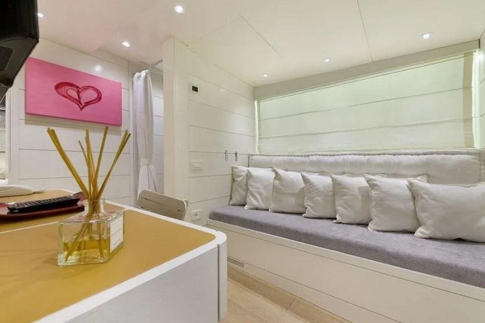 Luxurious interior of a 1964 Benetti 30m tug boat with modern decor and cozy seating.