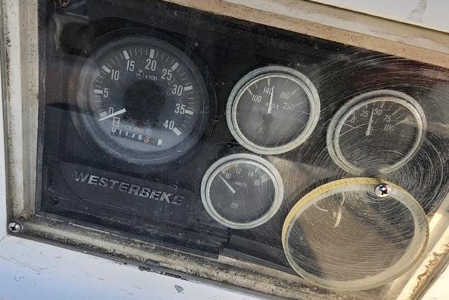 Dashboard gauges of a 1984 Bristol 45.5 Center Cockpit sailboat, featuring Westerbeke engine indicators.