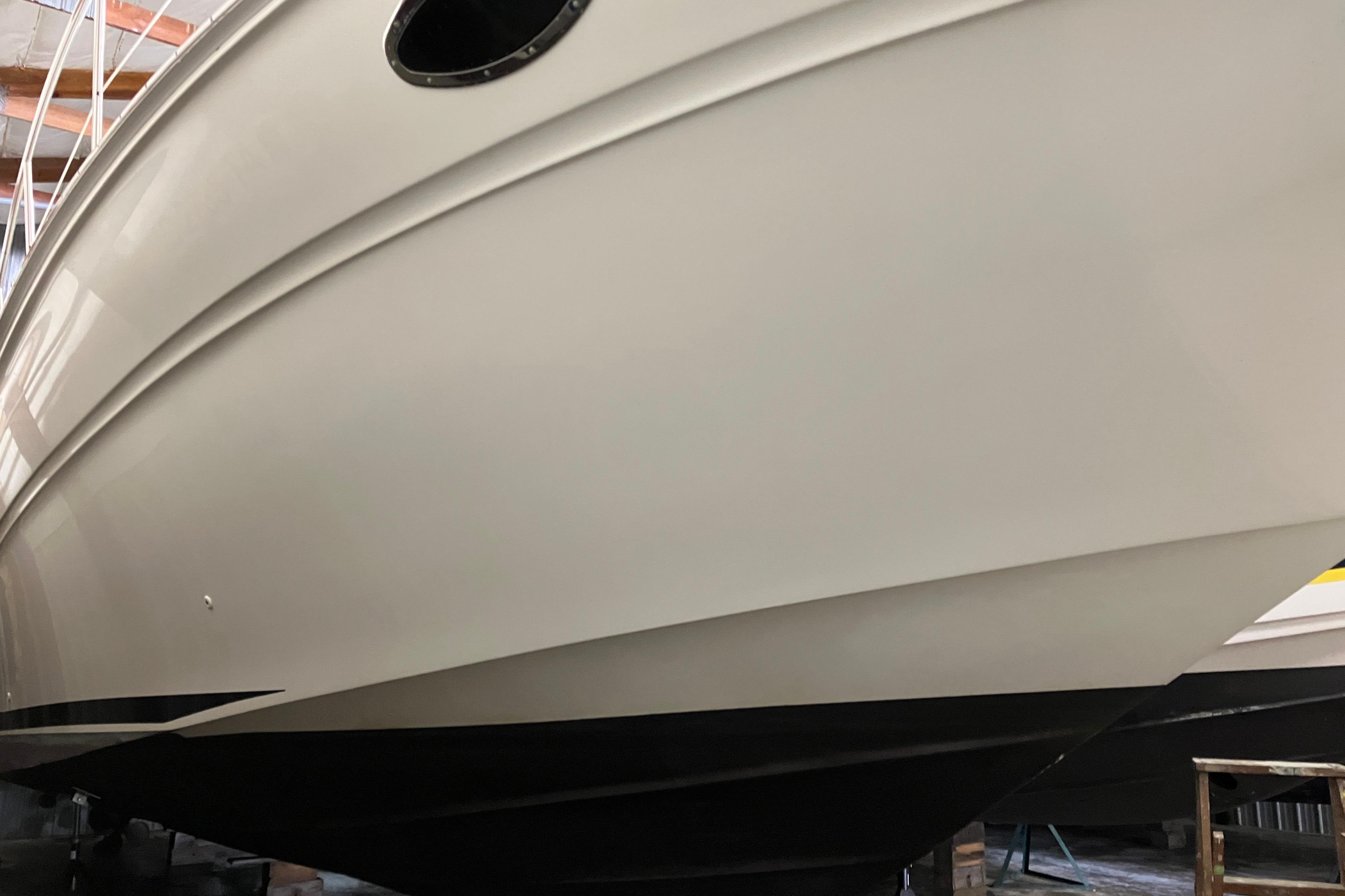 2002 Sea Ray 410 Sundancer boat hull in a storage facility.