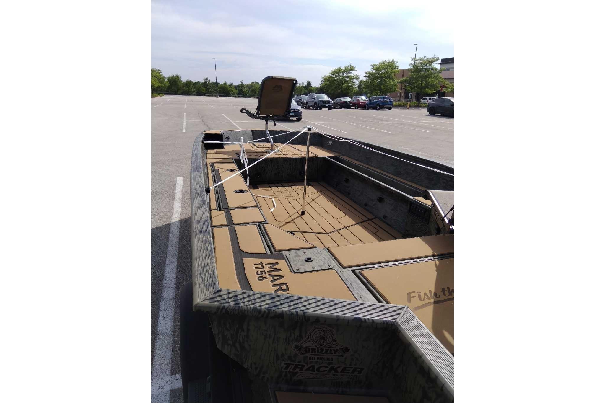2026 Tracker Grizzly 1756 T Marsh boat in parking lot, interior view.