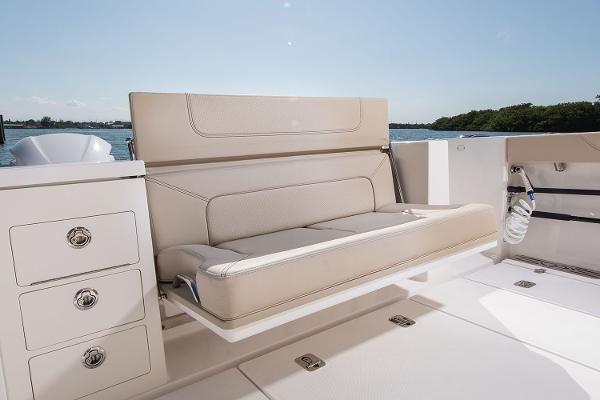 Manufacturer Provided Image: 2018 Pursuit S 368 Sport boat with beige seating and storage drawers.