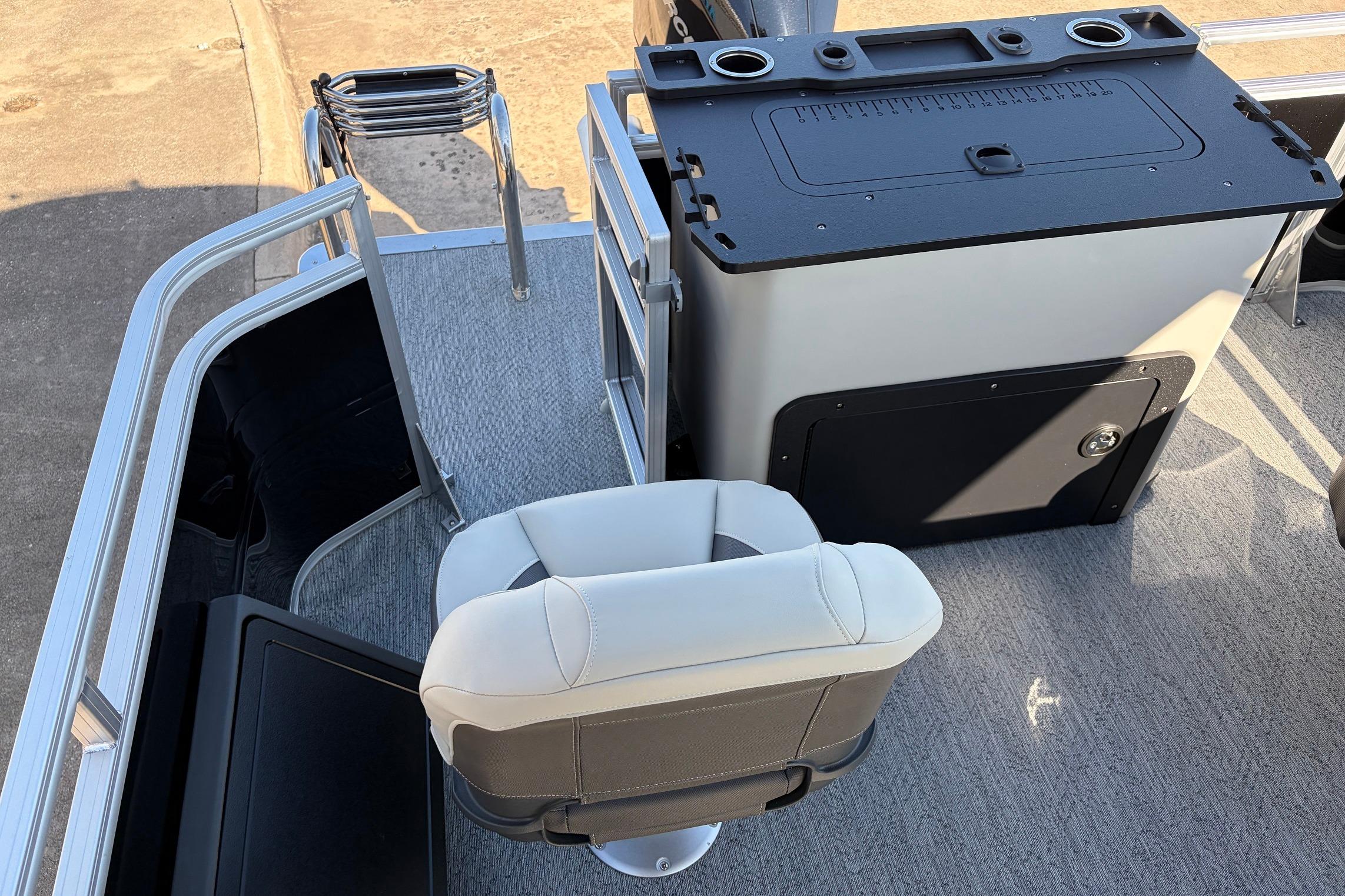 2026 Sun Tracker Fishin' Barge 22 XP3 interior with seating and storage area.
