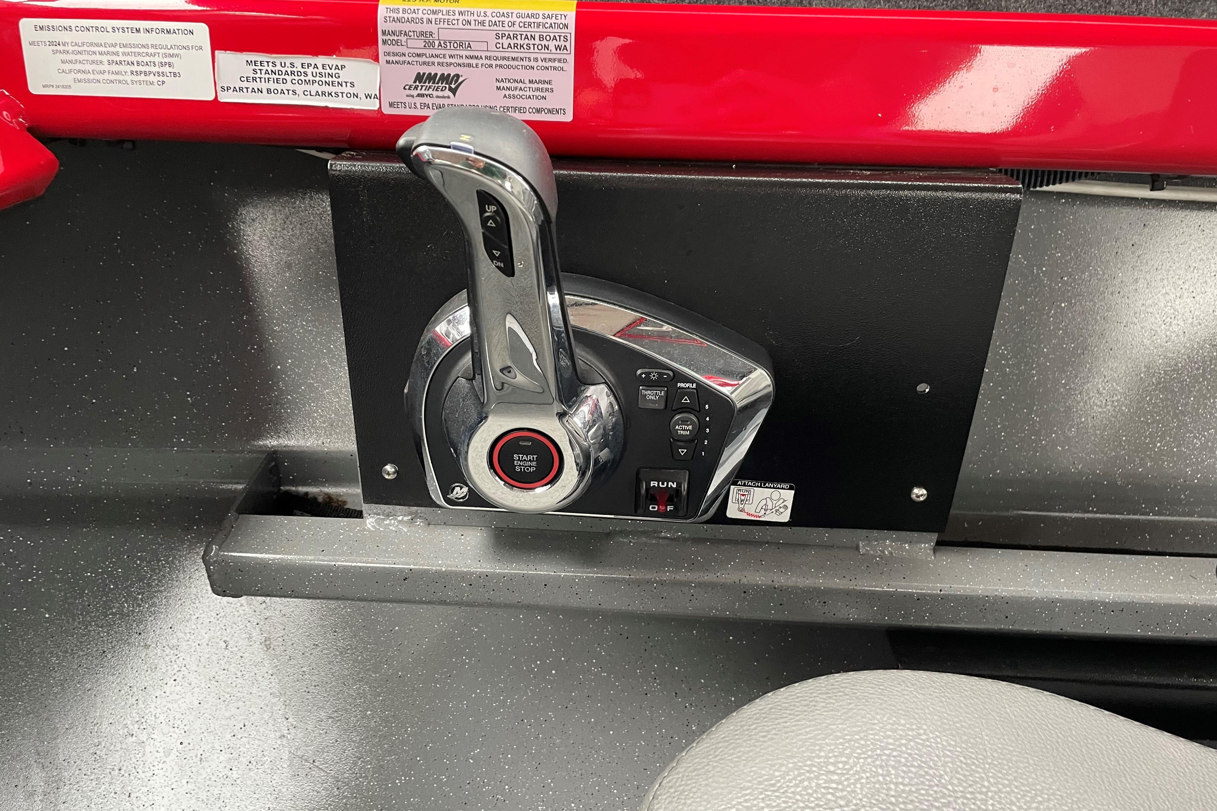 Throttle control panel of 2024 Spartan 200 Astoria boat, featuring start/stop button.
