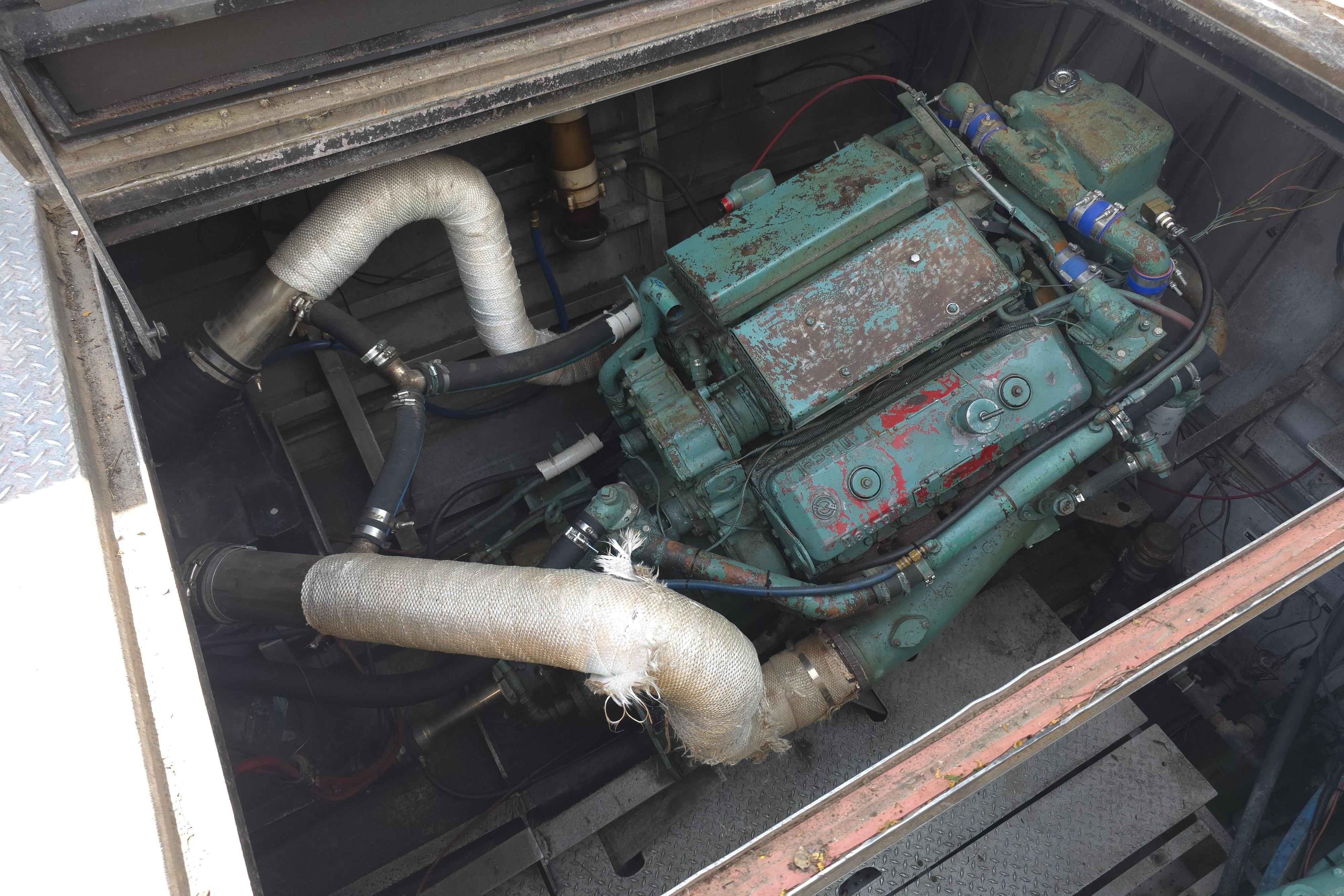 Engine compartment of a 1974 Breaux's Bay Craft Passenger with COI boat.