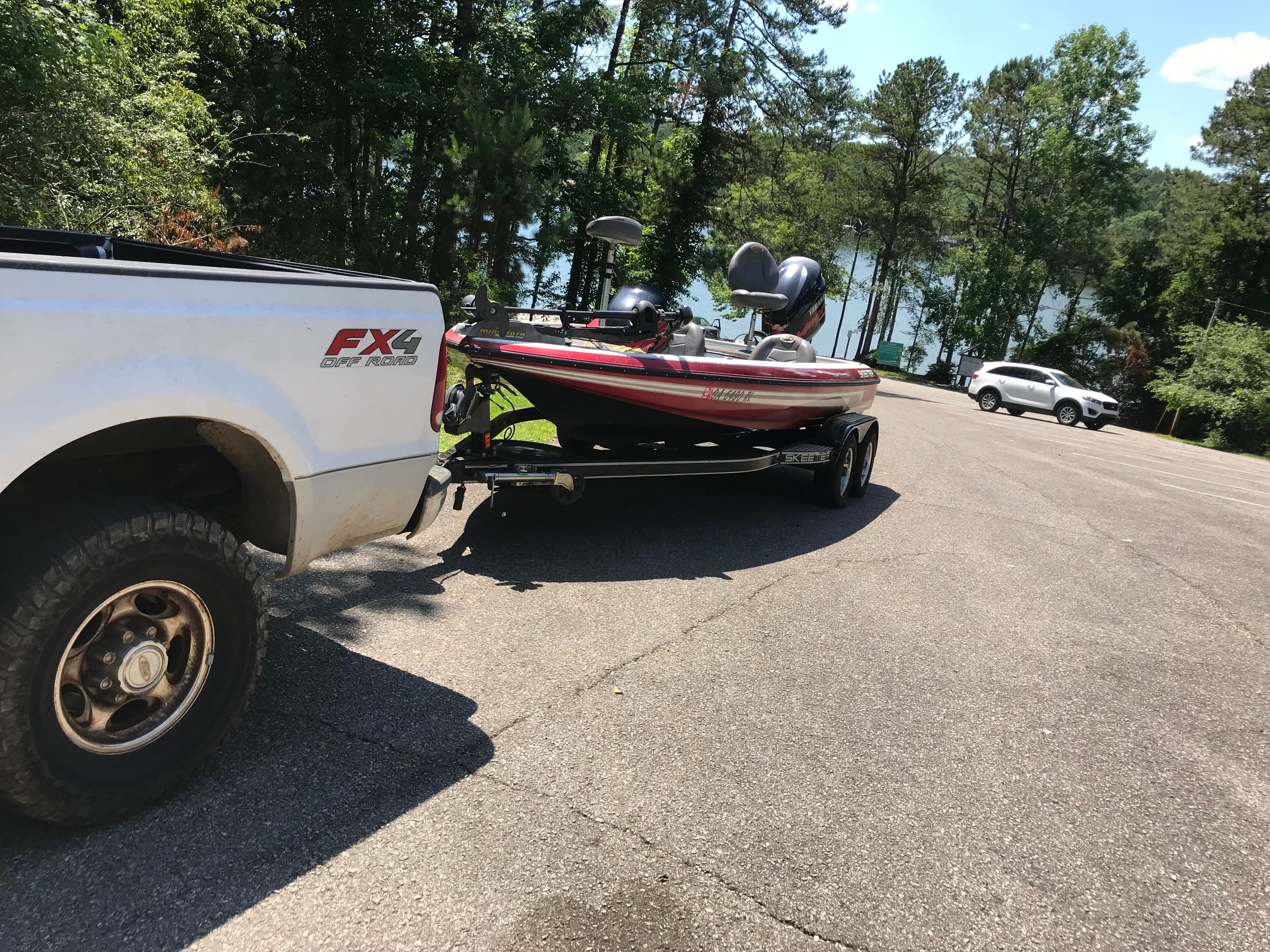 2007 Skeeter ZX200 boat on trailer behind pickup truck.