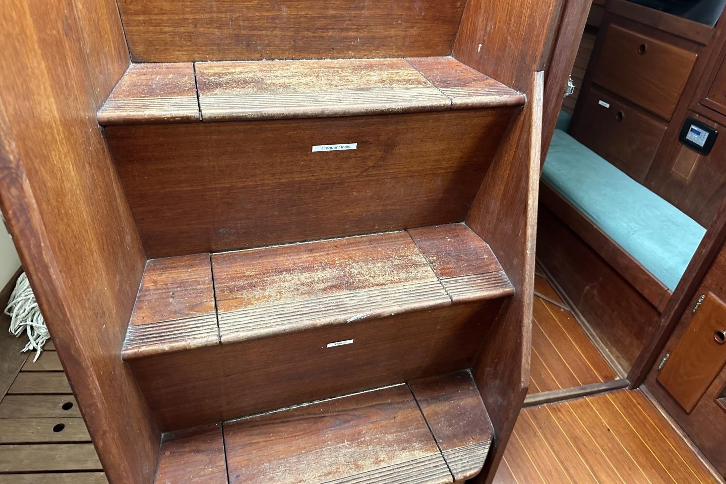 Wooden interior stairs on a 1991 Sabre 425 sailboat.