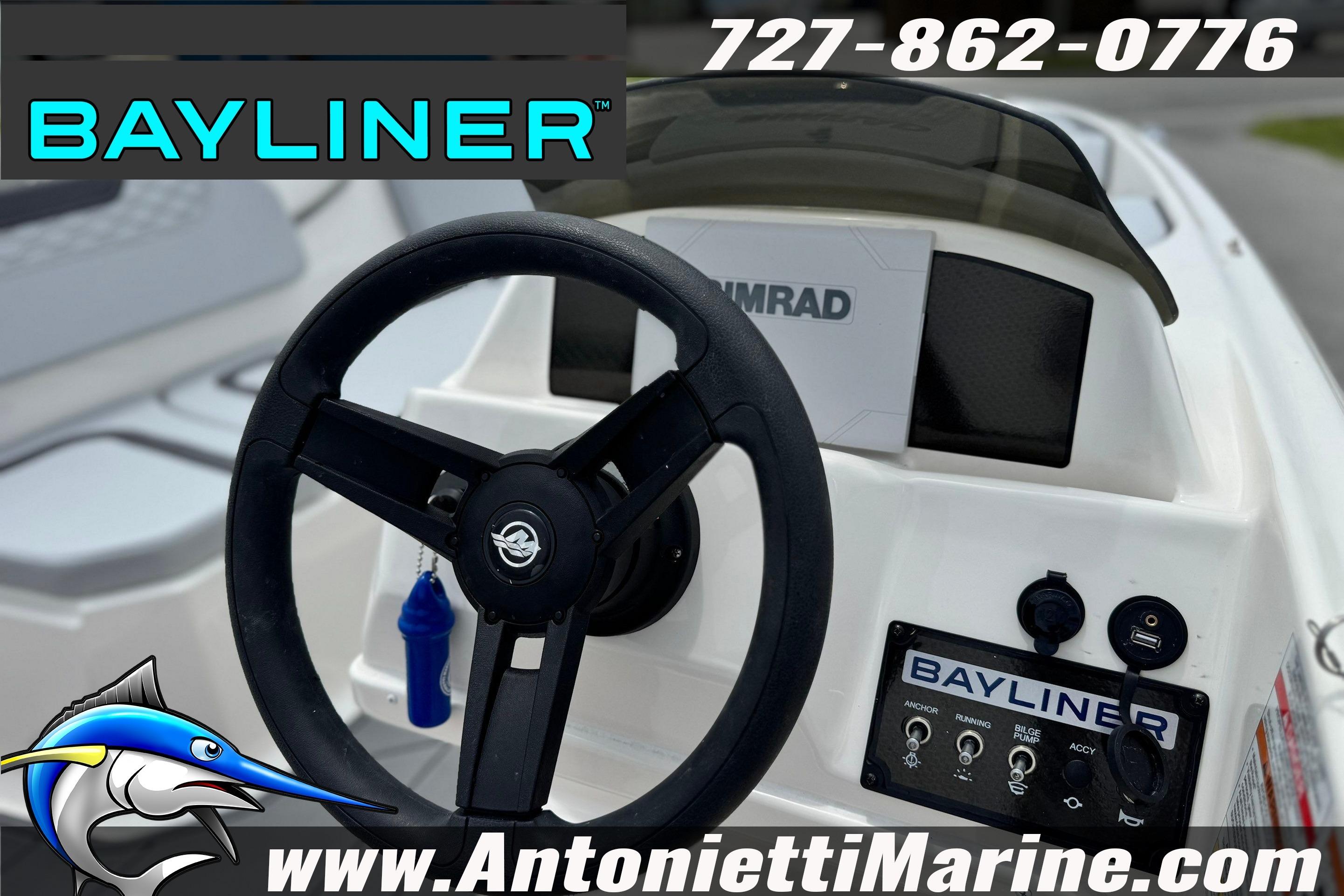 2024 Bayliner Element M15 boat dashboard with steering wheel and controls, featuring Bayliner branding.