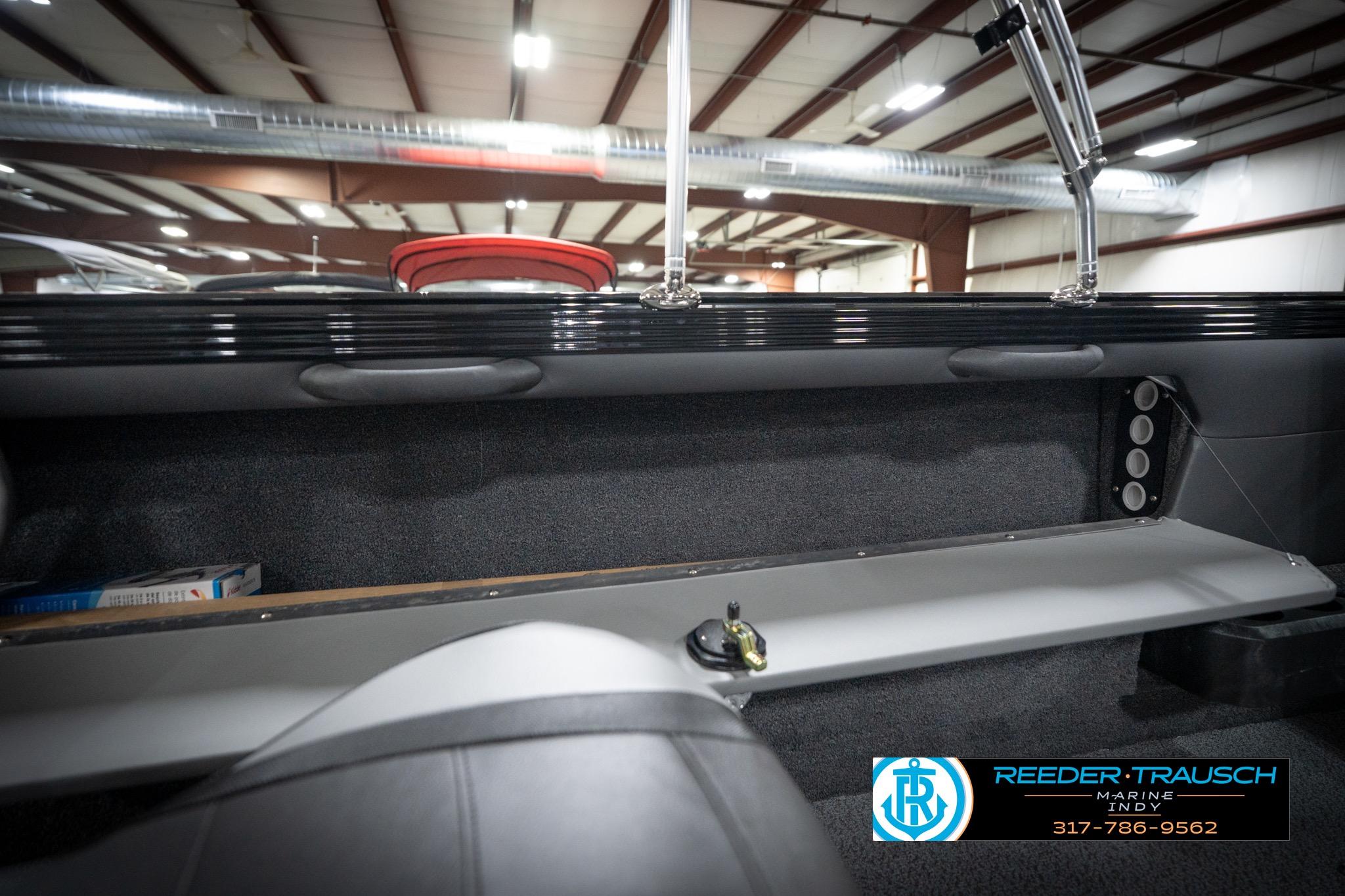 Interior view of 2026 Lund 2275 Baron boat in a showroom.