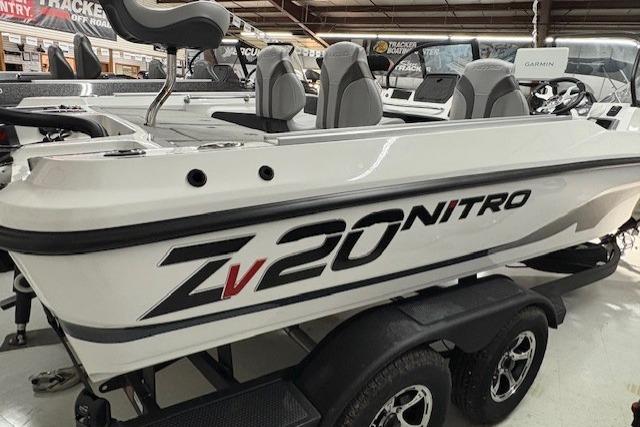 2026 Nitro ZV20 Sport Pro boat displayed in showroom, featuring sleek design and modern seating.