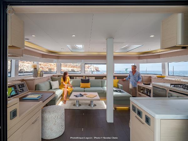 Luxurious interior of 2025 Lagoon 55 yacht with modern furnishings and ocean view.