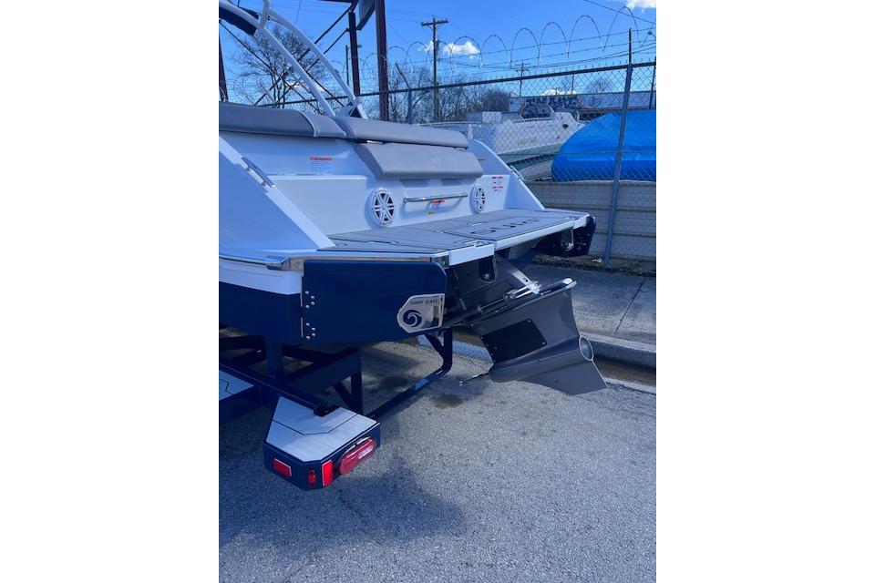 2025 Cobalt CS23 Surf boat rear view with swim platform and propeller.