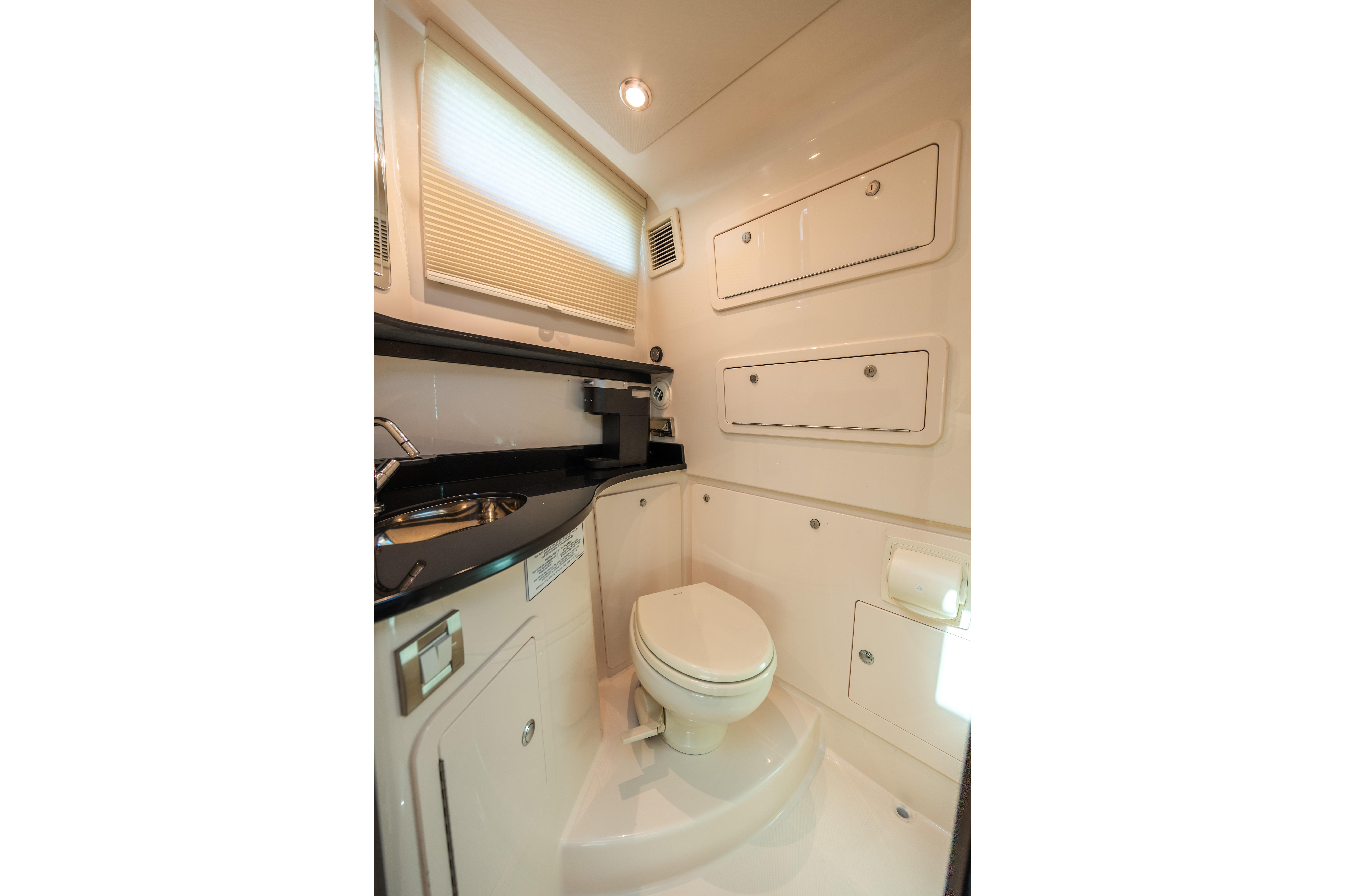 Luxurious bathroom interior of 2025 Grady-White Canyon 386 boat, featuring modern fixtures.
