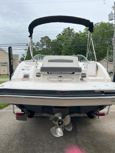 2014 Chaparral 244 Sunesta boat, rear view with propeller and swim platform.
