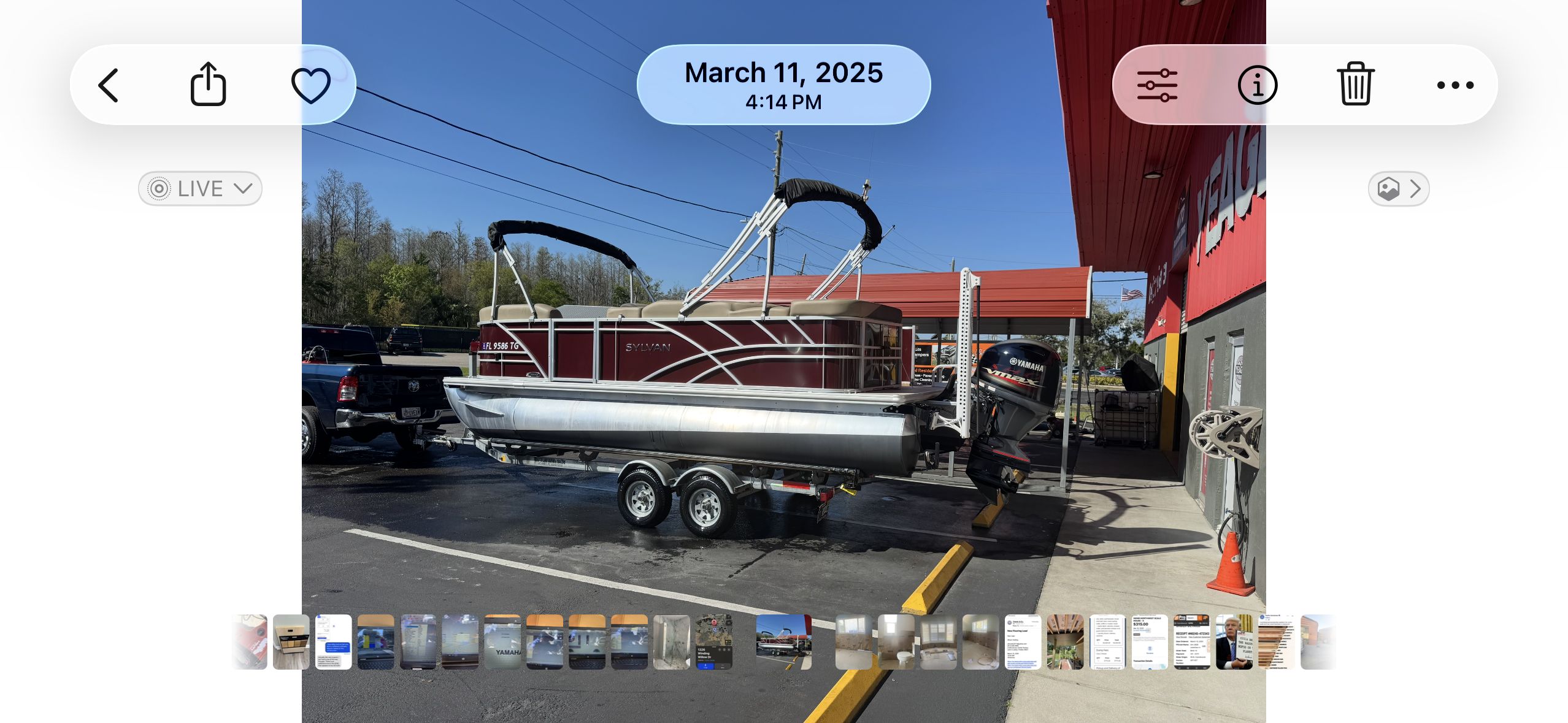 Sylvan Mirage 820 LZ pontoon boat, 2022, on trailer outside building.
