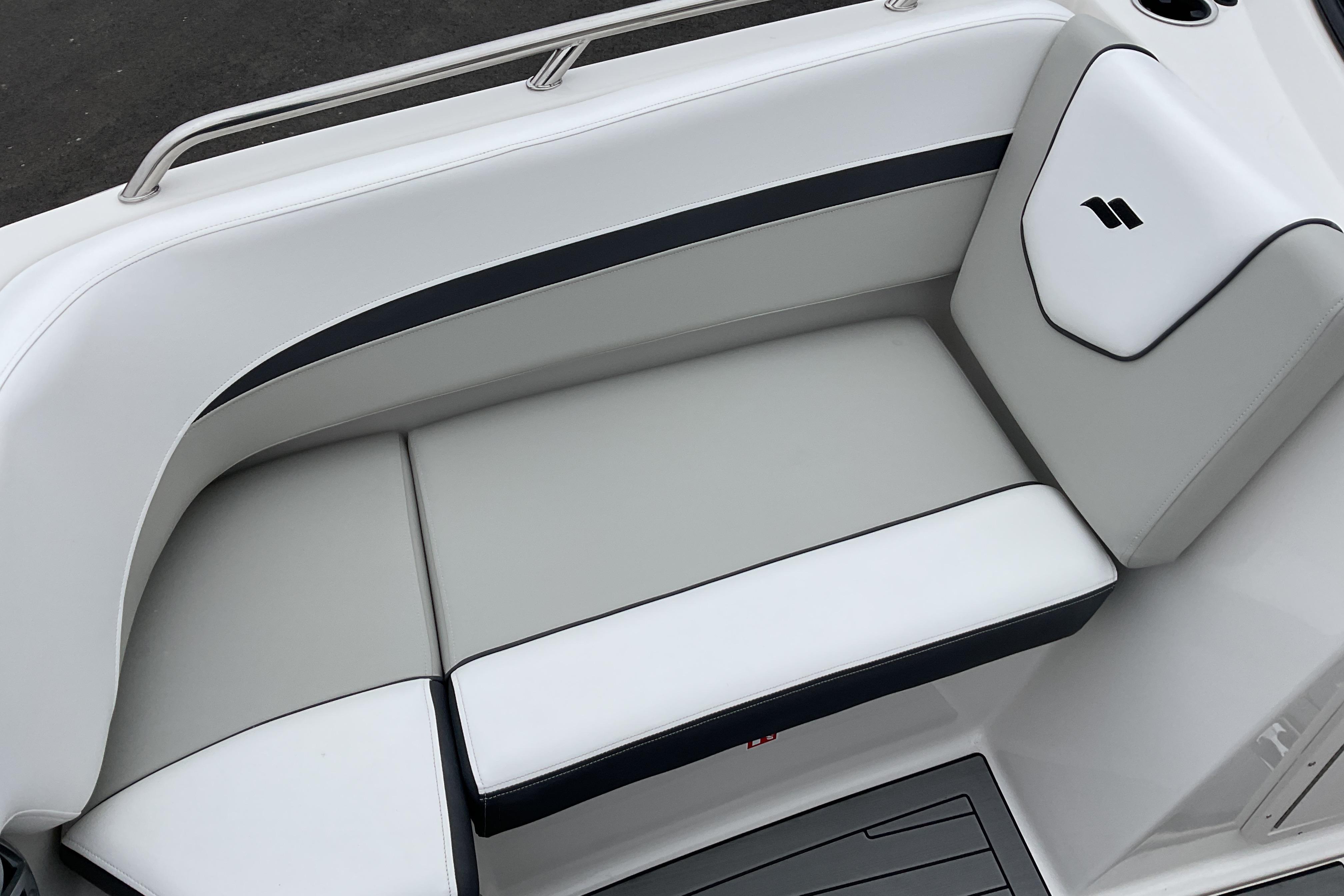 2026 Starcraft SVX 210 DC OB boat seating, featuring sleek white and black upholstery.