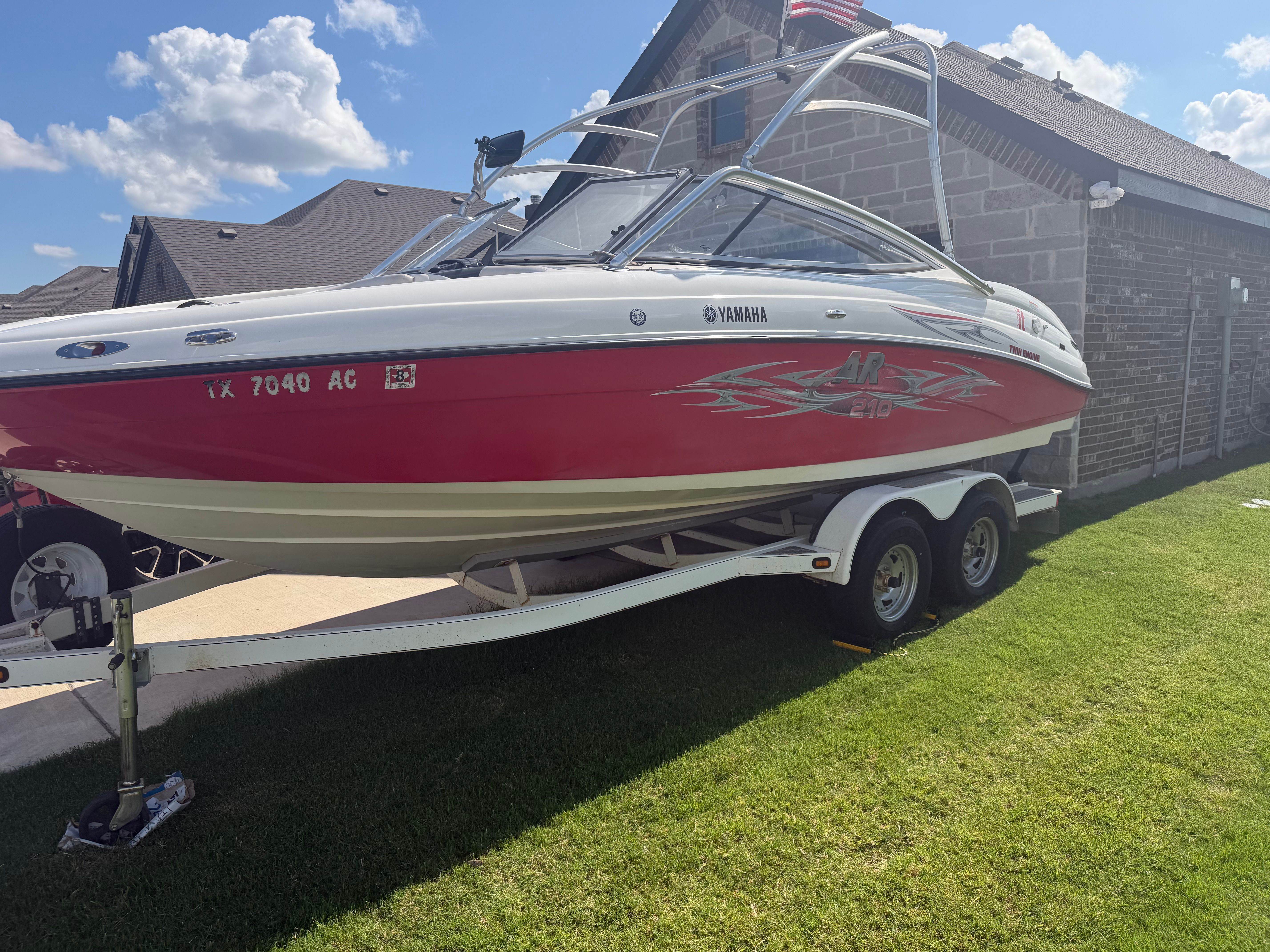 2006 Yamaha AR210 boat on trailer outdoors.