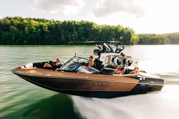 Manufacturer Provided Image: 2025 Moomba Mojo boat cruising on a lake with passengers enjoying the ride.