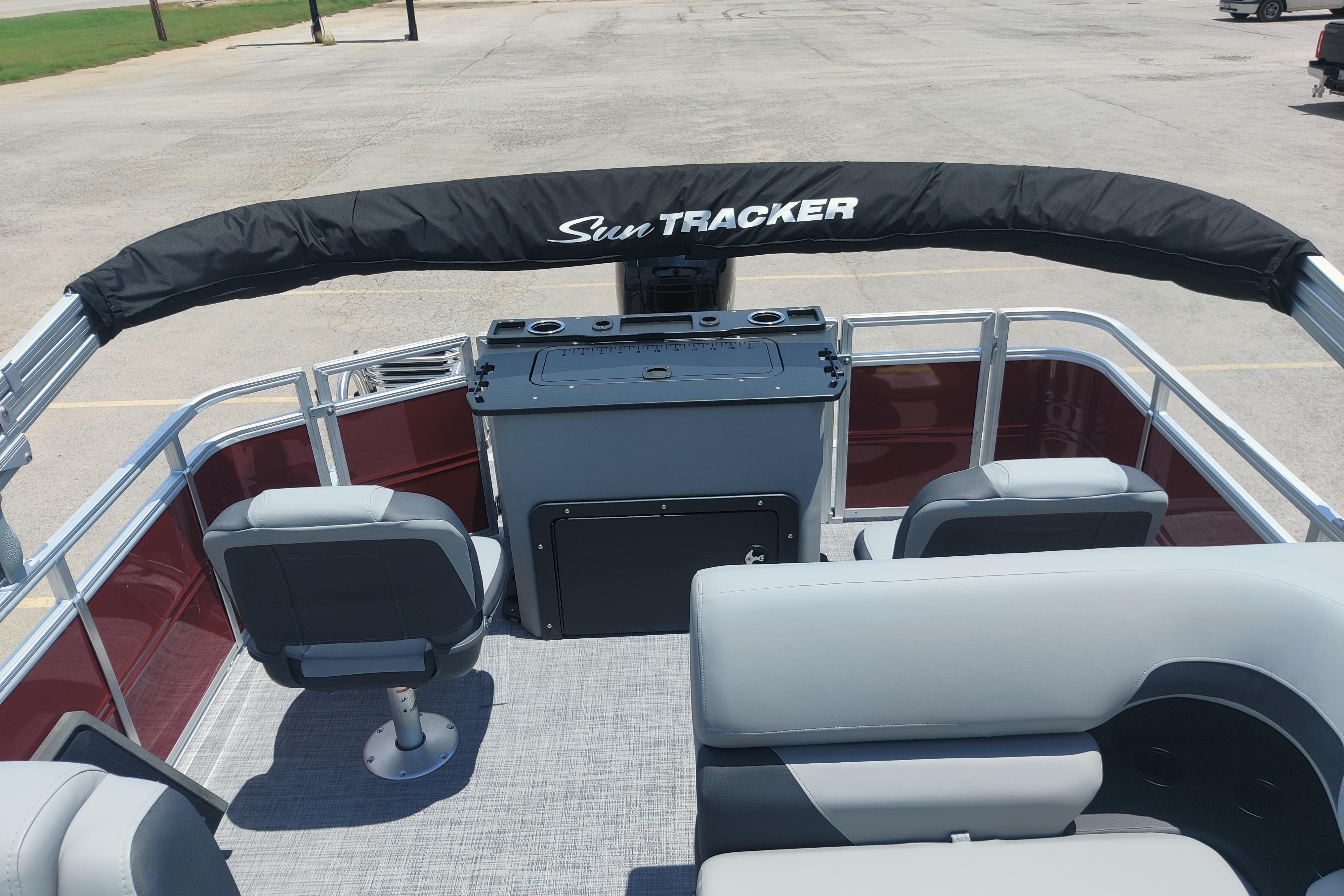 2026 Sun Tracker SportFish 22 DLX pontoon boat interior with seating and helm.