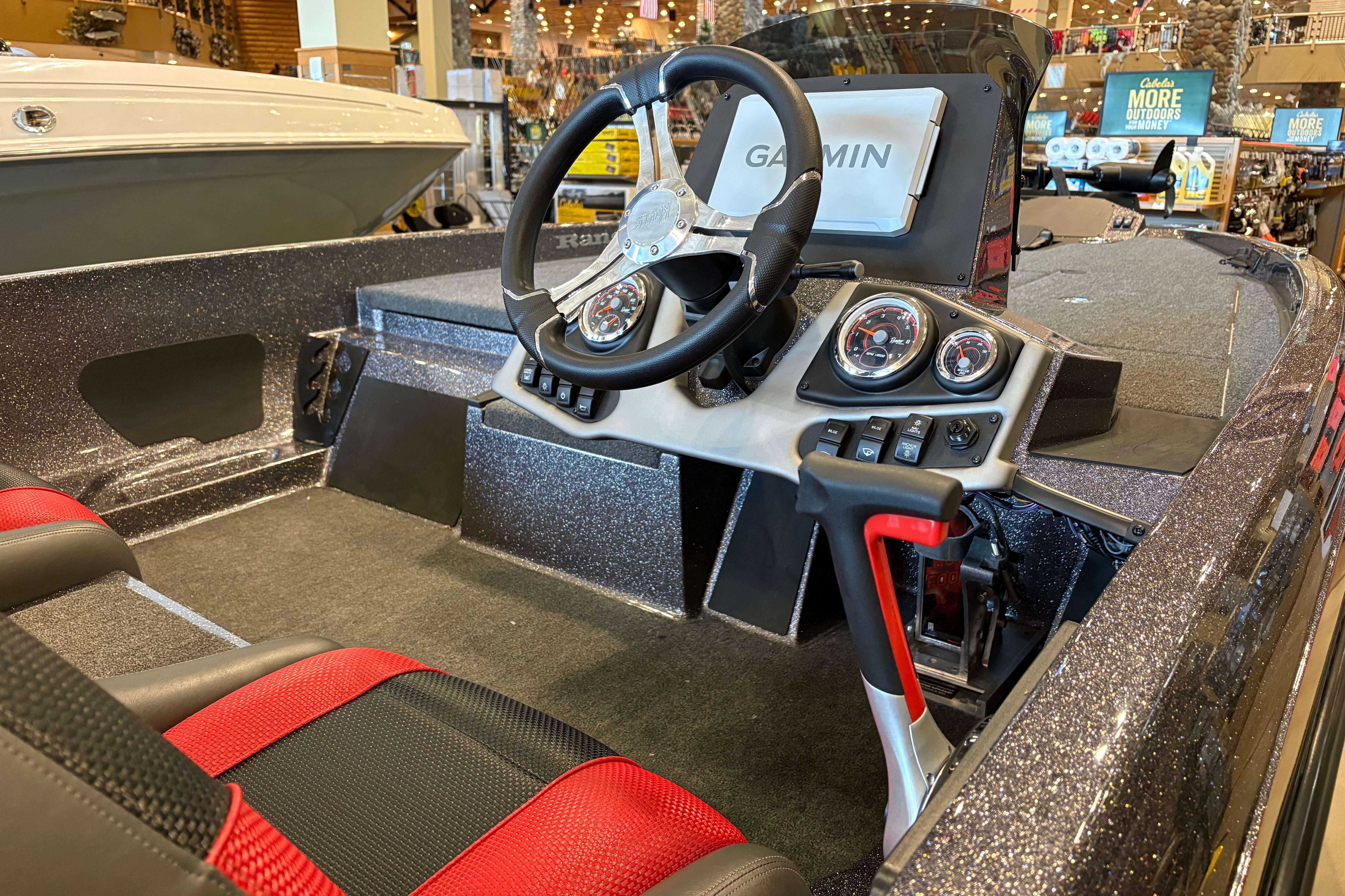 2025 Ranger Z185 boat interior with Garmin navigation, steering wheel, and red-accented seats.