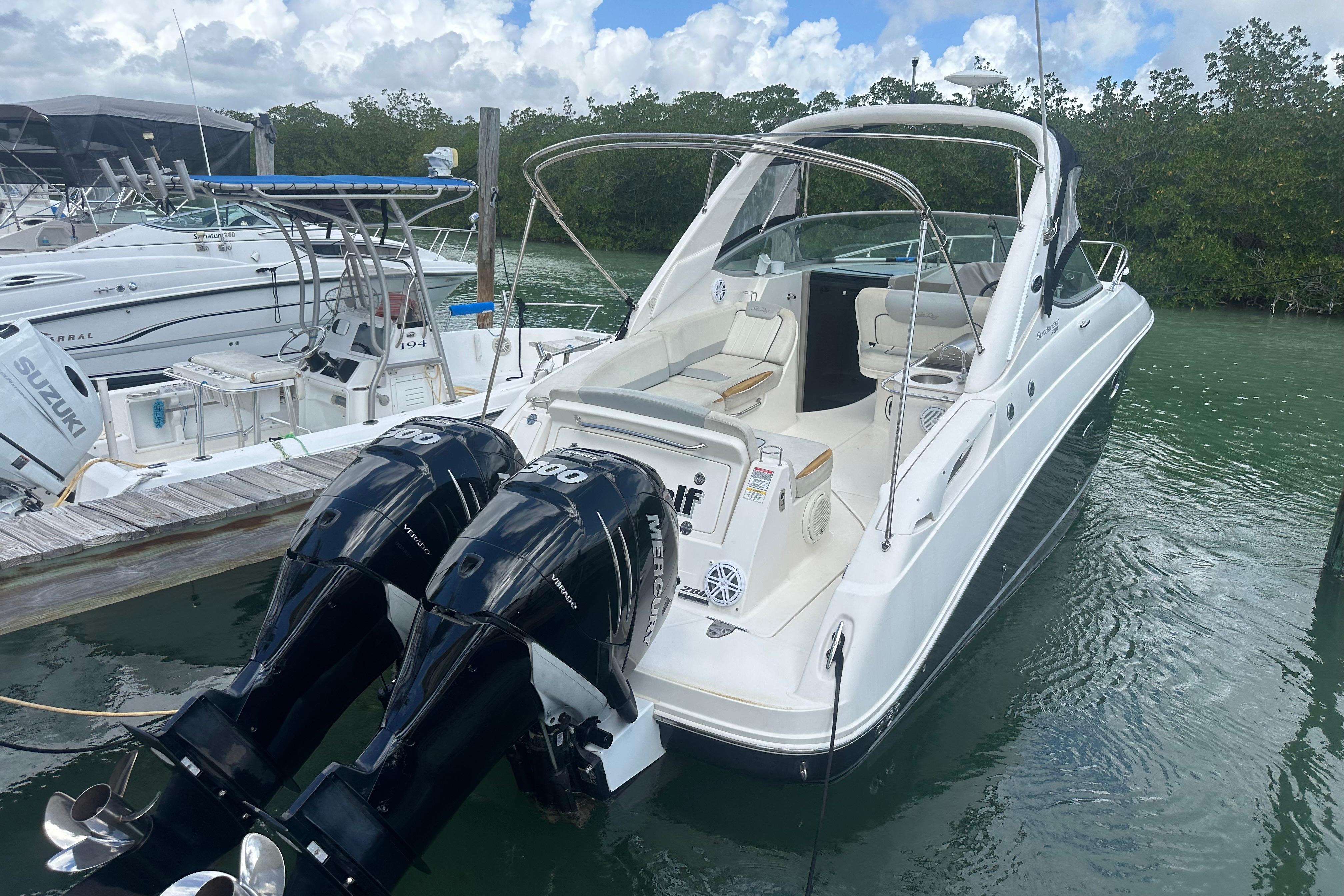 2011 Sea Ray Sundancer 280 docked with twin Mercury outboard engines.