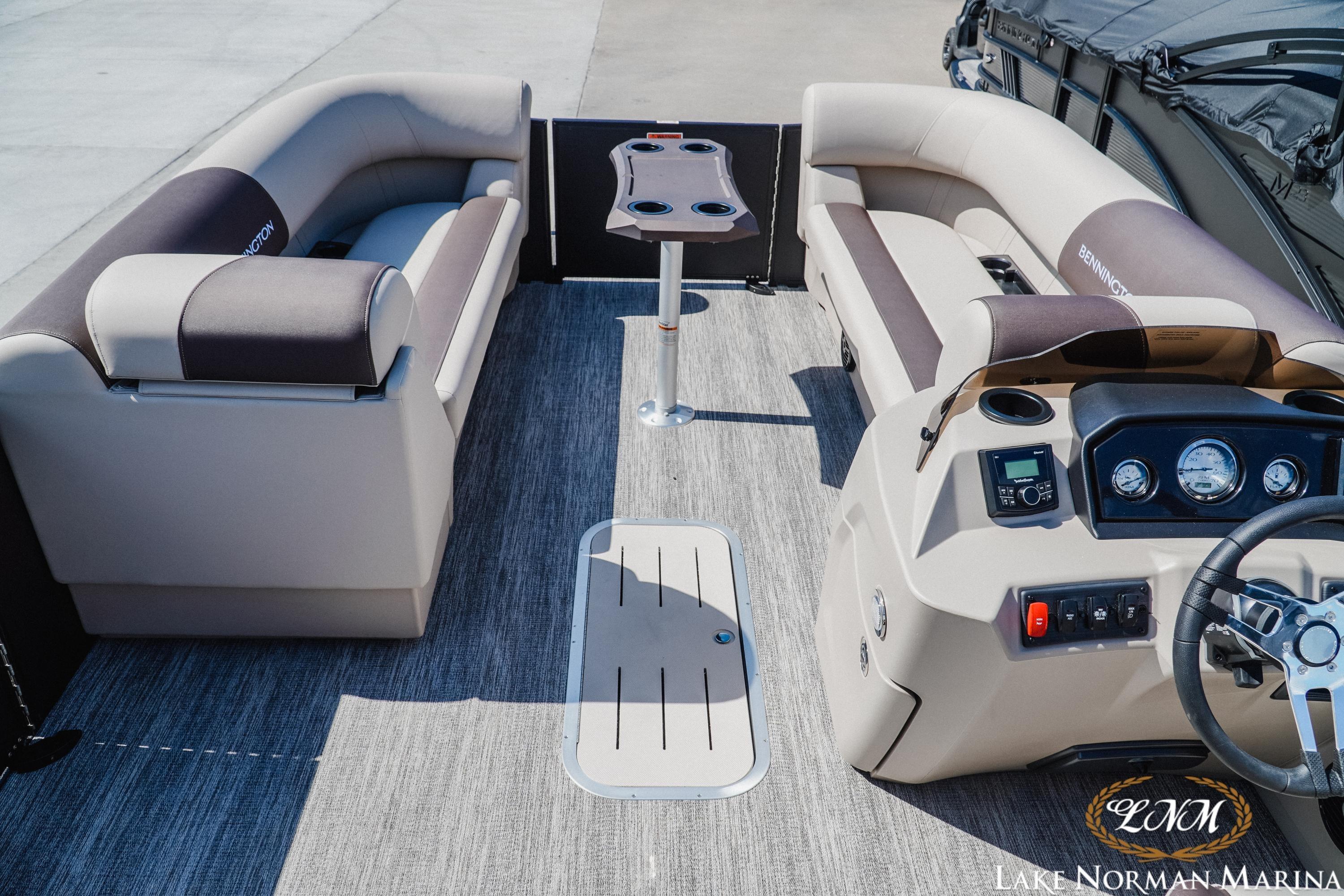 2027 Bennington 23ssb pontoon boat interior with plush seating and modern dashboard.