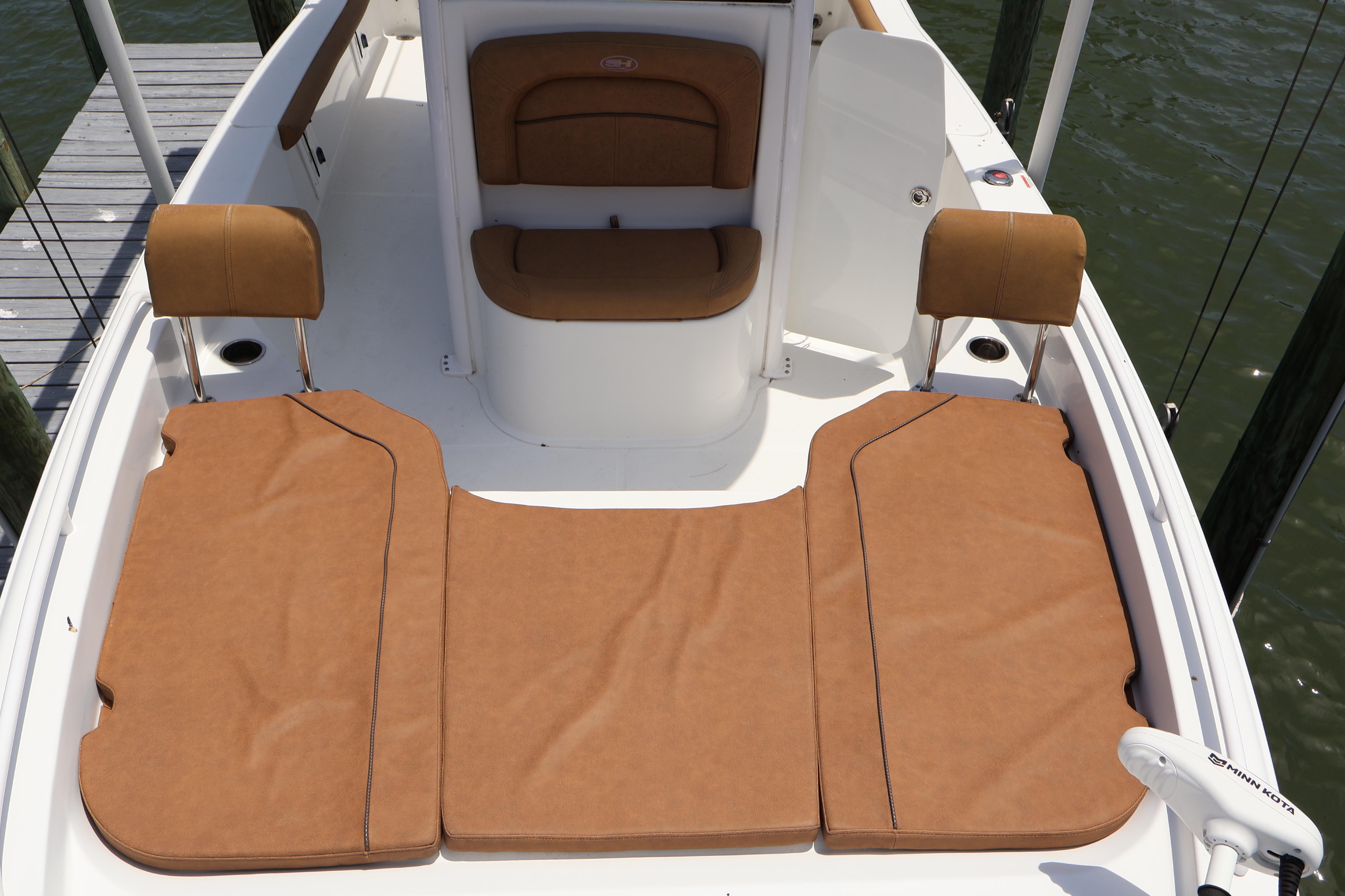 2022 Sea Hunt BX 25 FS boat deck with tan cushioned seating and Minn Kota trolling motor.