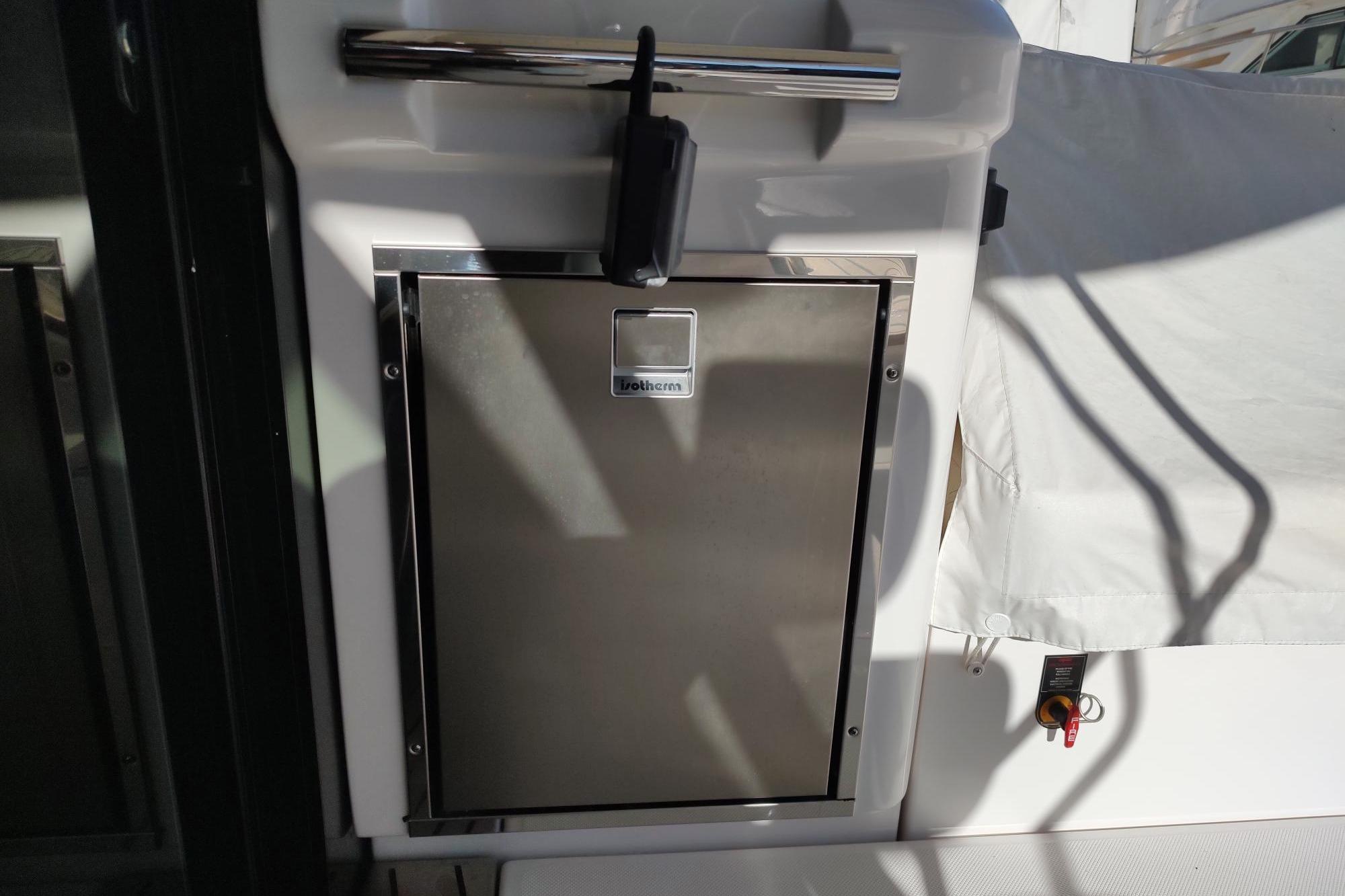 Stainless steel refrigerator on 2021 Regal 42 Fly yacht deck.
